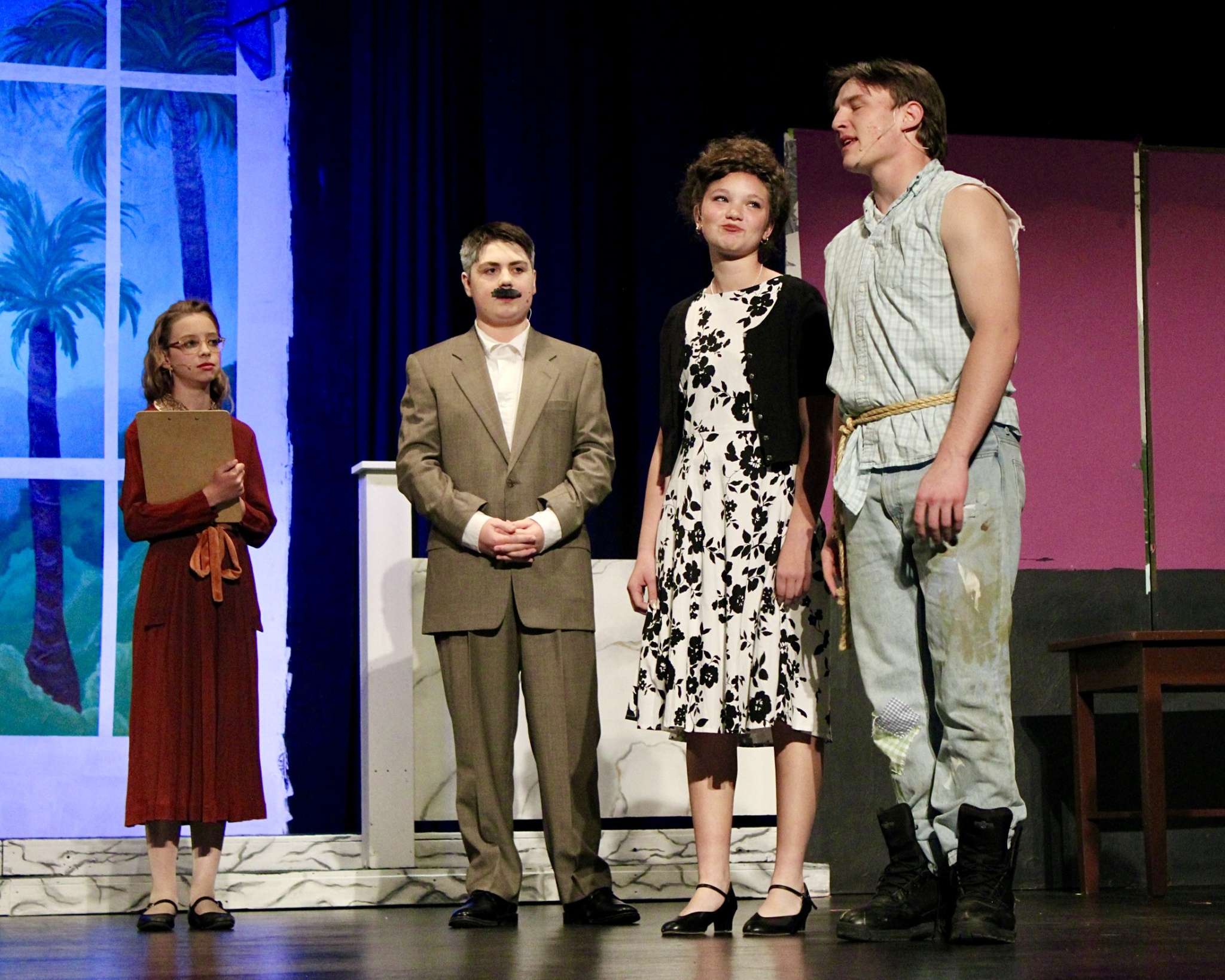 Several characters on stage for Thomas More Prep-Marian's "The Beverly Hillbillies" production. Photo by Tony Guerrero/Hays Post