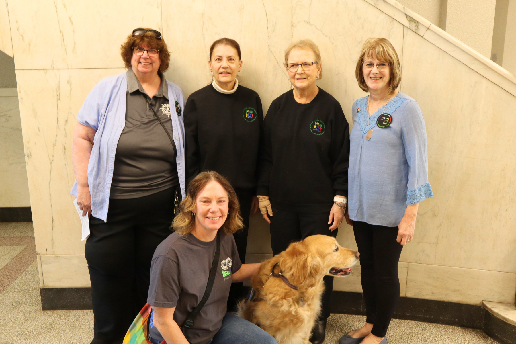 Pilot Club members and service dog Star, whose efforts continue to support first responders and  individuals with autism across Barton County.