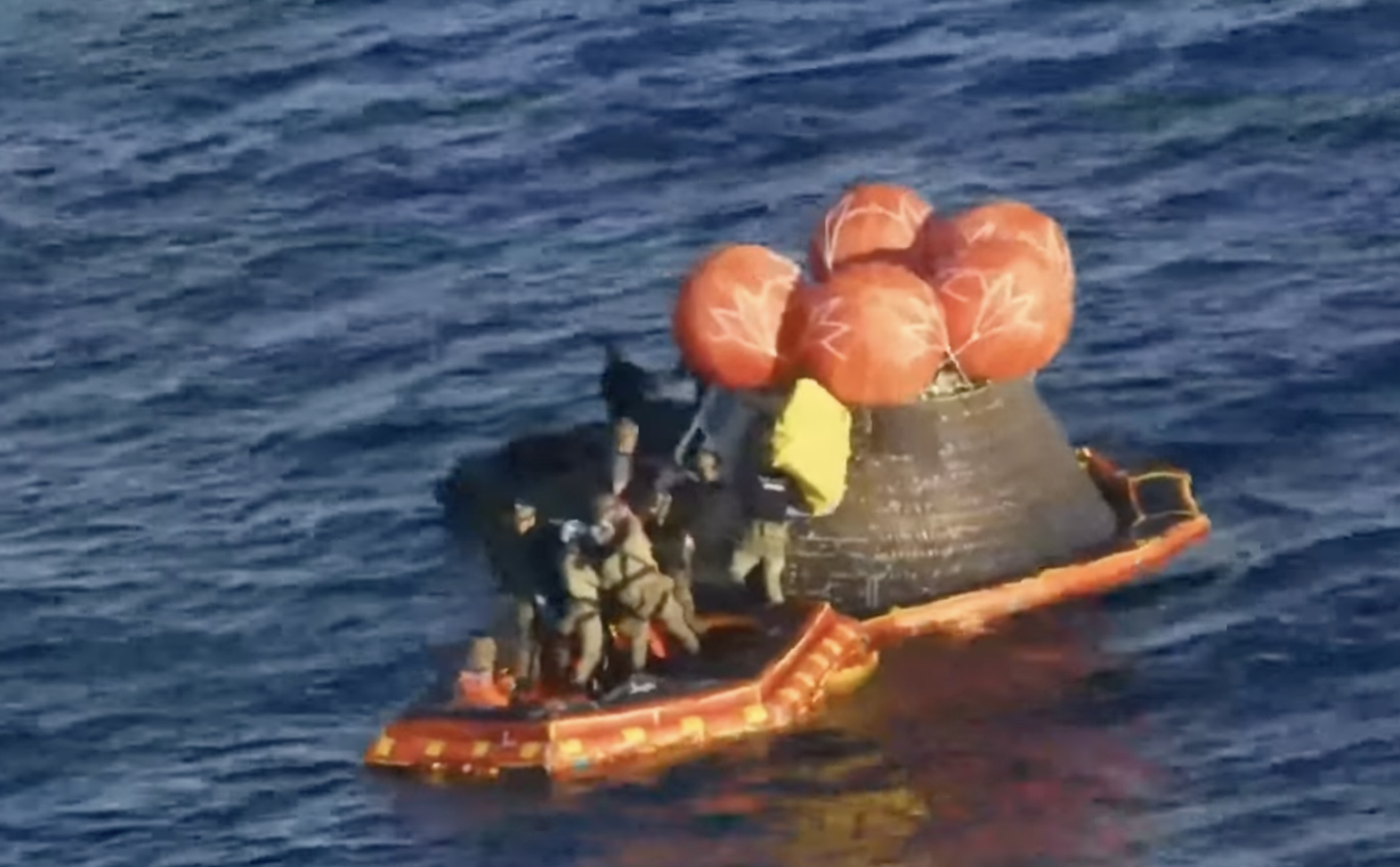 The astronauts emerge from the spacecraft-image from NASA video