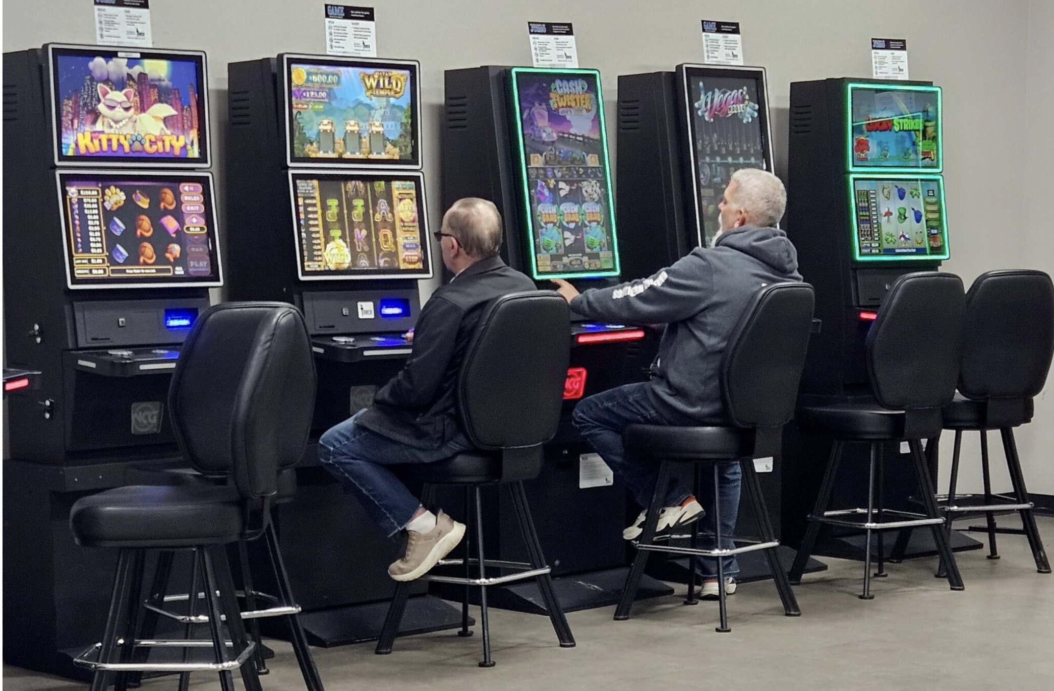  Customers play Torch slot machines Friday at a Columbia convenience store despite a promise from the company that all its games would be shut off (Rudi Keller/Missouri Independent).