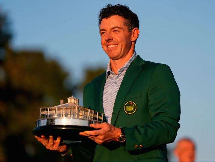 Rory McIlroy, of Northern Ireland, holds the trophy after winning the Masters golf tournament at the Augusta National Golf Club, Sunday, April 12, 2026, in Augusta, Ga. (AP Photo/Ashley Landis)