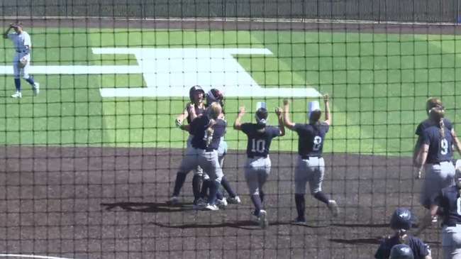 Blue Dragon teammates run out to celebrate with Riley Dreher after her walk-off single in the bottom of the eighth inning of a 5-4 come-from-behind victory over the Barton Cougars on Monday at Fun Valley.