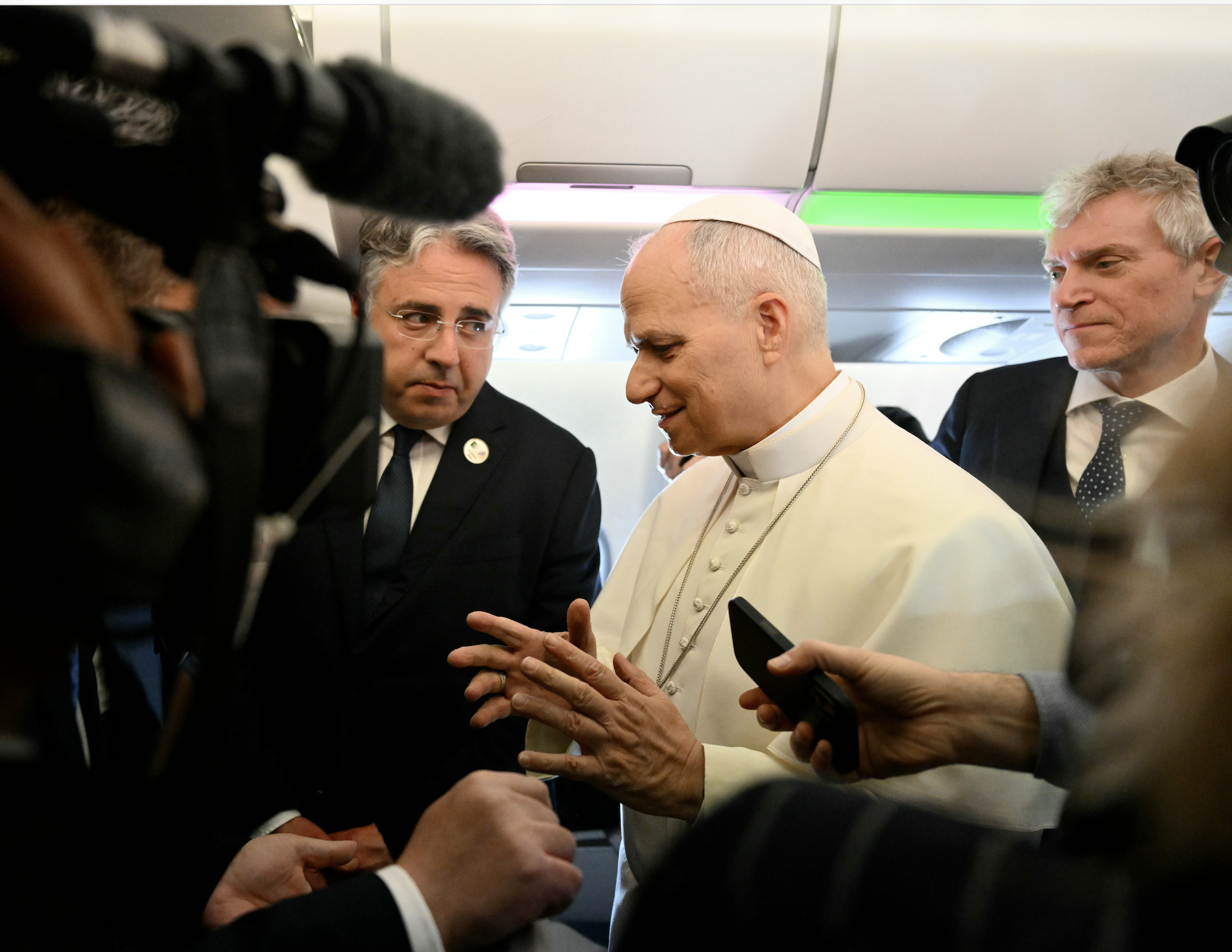 Pope Leo XIV speaks to journalists aboard his flight bound for Algiers’ Houari Boumédiène International Airport on Monday, April 13, 2026, at the start of an 11-day apostolic journey to Africa. (Alberto Pizzoli/Pool Photo via AP)