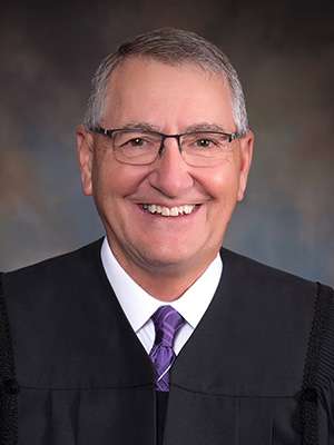 Magistrate Judge Richard Flax<br>