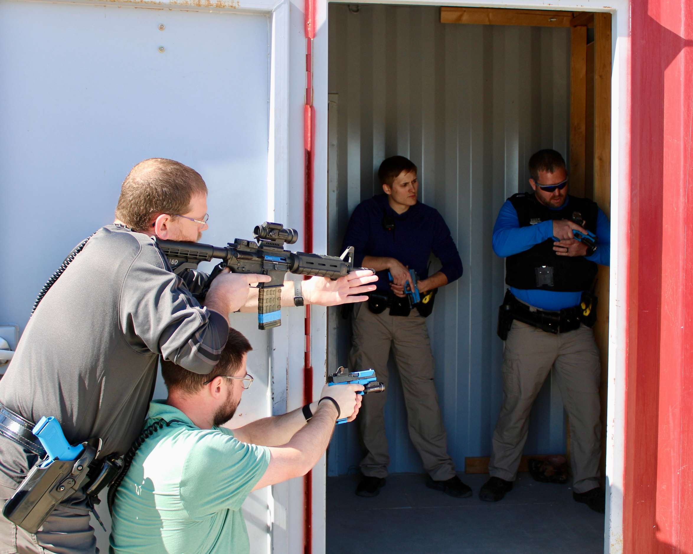 Hays police officers preparing to make entry into a barricaded room during a training session. Photo by Tony Guerrero/Hays Post