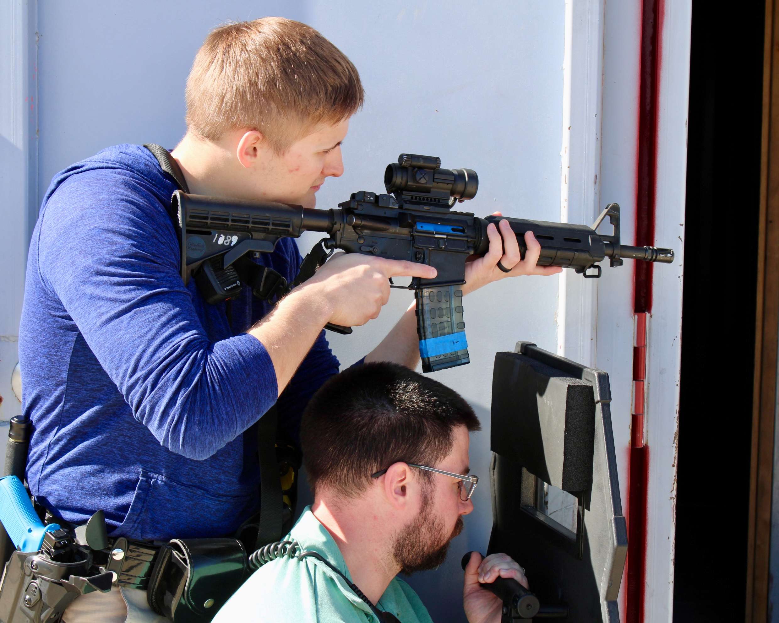 Two Hays police officers in position with a firearm and a shield during a training session. Photo by Tony Guerrero/Hays Post