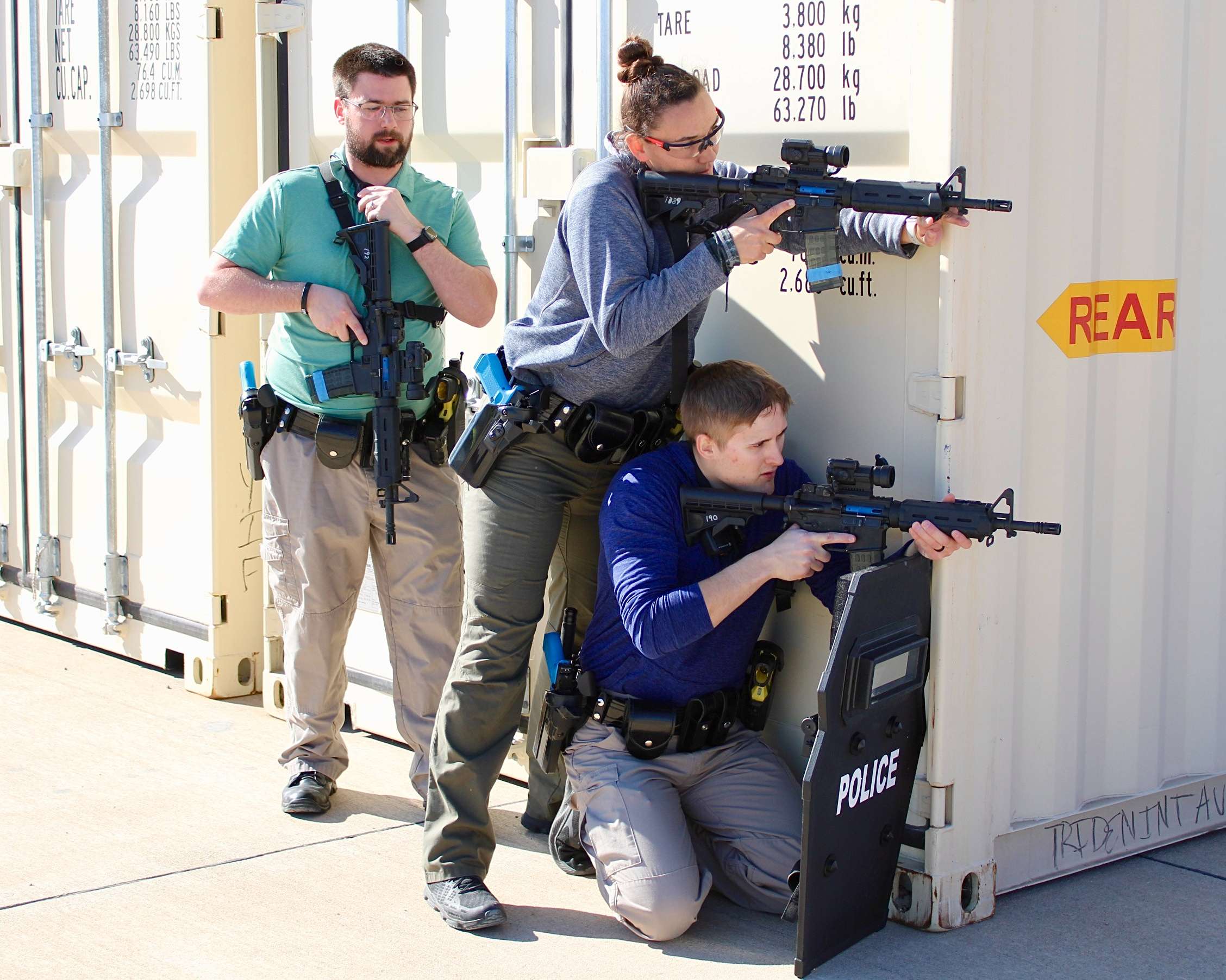 Three Hays police officers getting ready to move towards the scene of a critical incident during a training session. Photo by Tony Guerrero/Hays Post