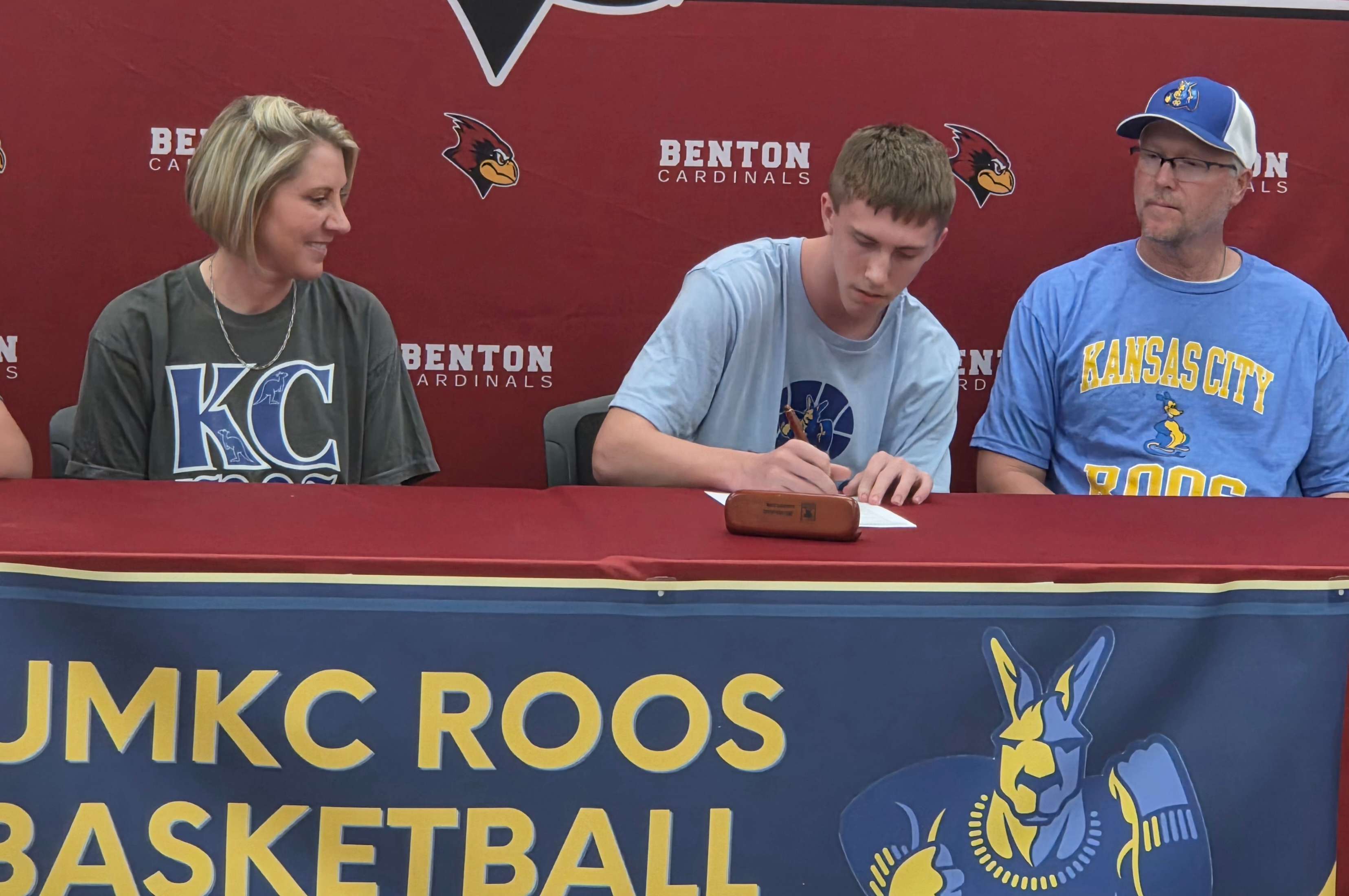 Benton's Lincoln Goodwin signs his National Letter of Intent to play basketball at the University of Missouri-Kansas City.&nbsp; Goodwin leaves Benton as one of the top Cardinal's basketball players, scoring 1,947 career points, with 454 rebounds, 233 assists, and 178 steals/ Photo by Matt Pike