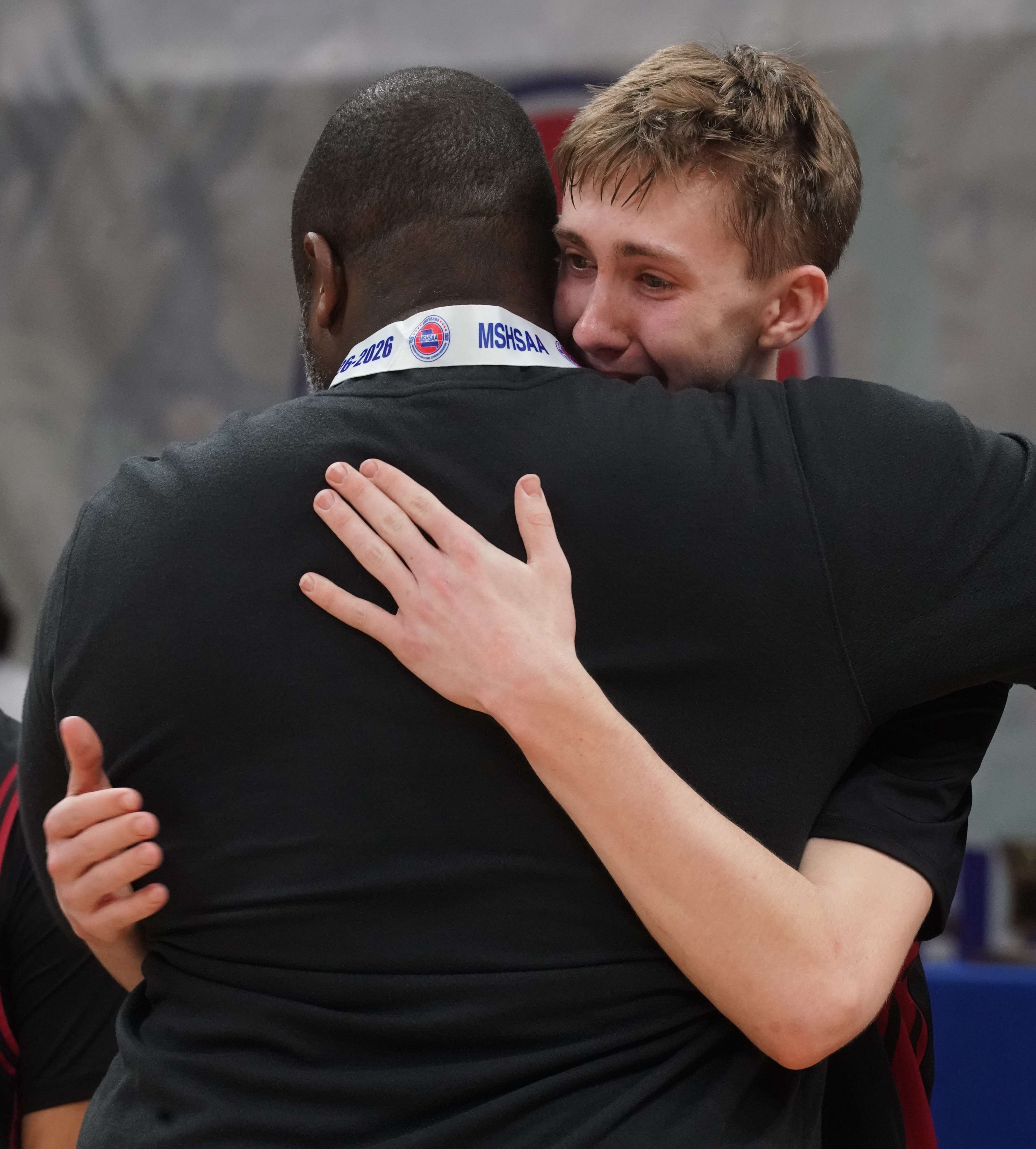 Lincoln Goodwin and head coach Jared Boone embrace following the Benton Cardinals 84-81 win in the MSHSAA Class 4 Third Place game/ Photo courtesy of Clifton Grooms