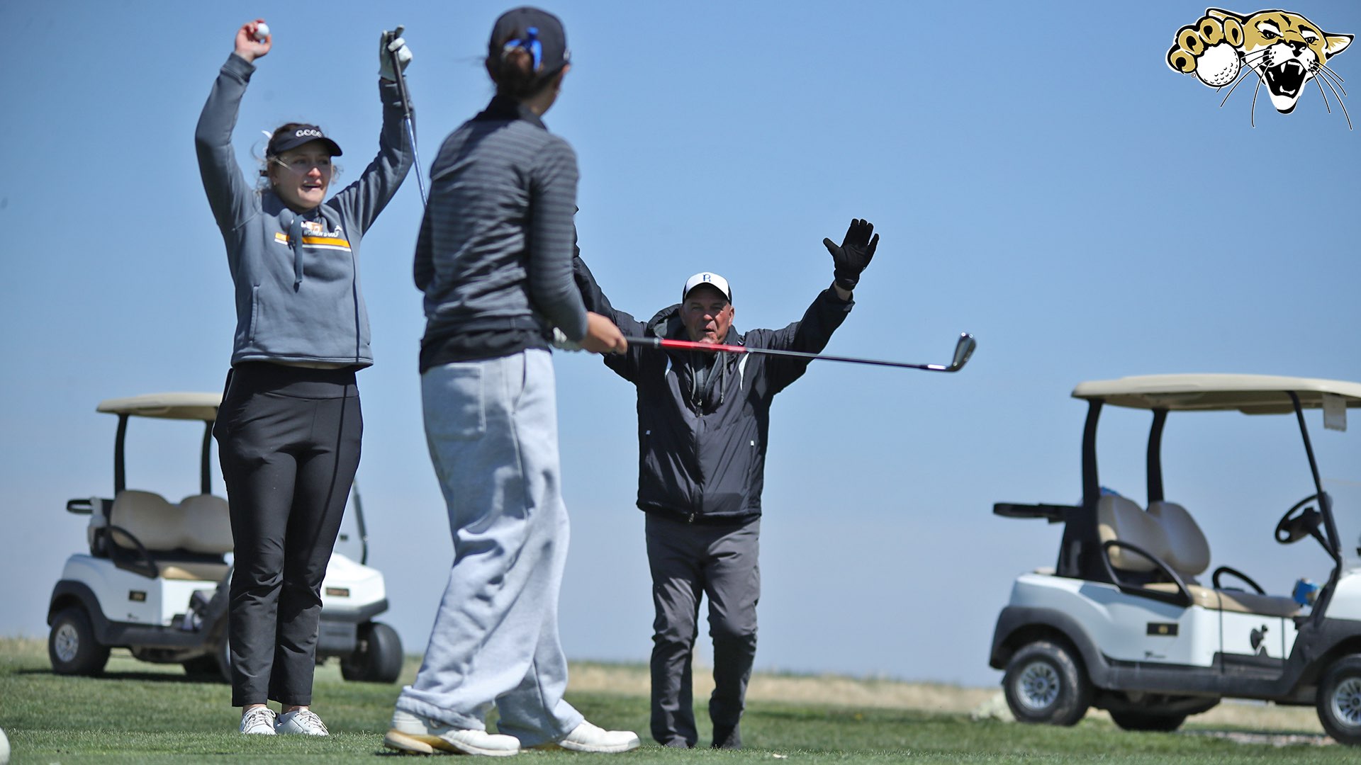Head Coach Doug Kaiser and playing partner Holly Duddy (Garden City) celebrating Panalee Prachavittayagon's hole-in-one Friday on Hole 18 (BartonSports.com)