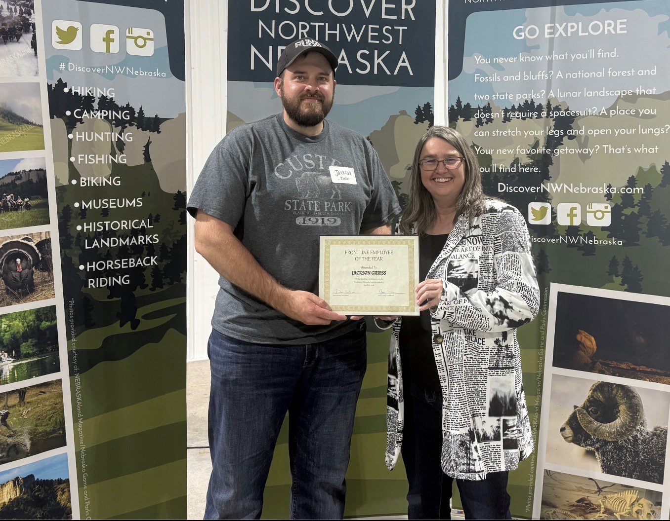 Discover Northwest Nebraska Director Kerri Rempp, right, presents Jackson Griess, left, with the Frontline Employee award April 16. Photo by Jess Espinoza/Crawford Clipper-Harrison Sun