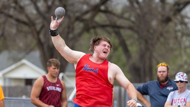RELAYS  Joshua Sweetnam breaks the school record in the shot put in winning the event at the ESU Relays on Thursday in Emporia. (Photo by Ed Bailey) Joshua Sweetnam breaks the school record in the shot put in winning the event at the ESU Relays on Thursday in Emporia. (Photo by Ed Bailey)