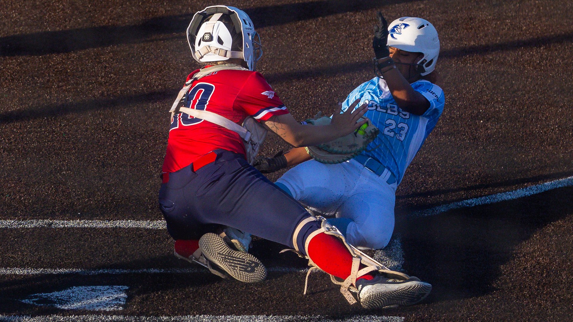Blue Dragon catcher Tailor Golly tags out a Colby runner at home plate in a 5-1 victory over the Trojans in Game 2 of a KJCCC doubleheader on Thursday at Fun Valley. (Sydney Holzrichter/Blue Dragon Sports Information)