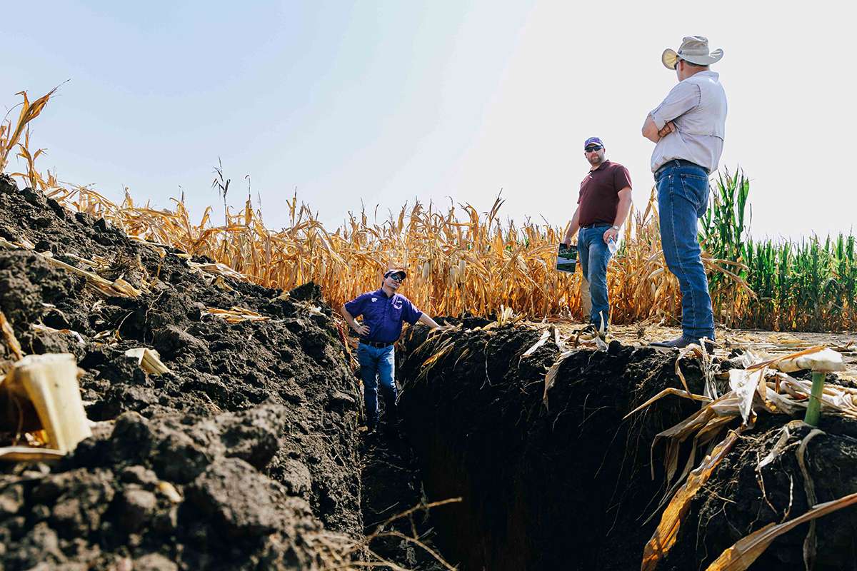 K-State agronomy researchers like Dorivar Ruiz Diaz, left, regularly travel to Flickner Innovation Farm to conduct field-scale agricultural research. (Photo courtesy K-State News and Communications Services.)