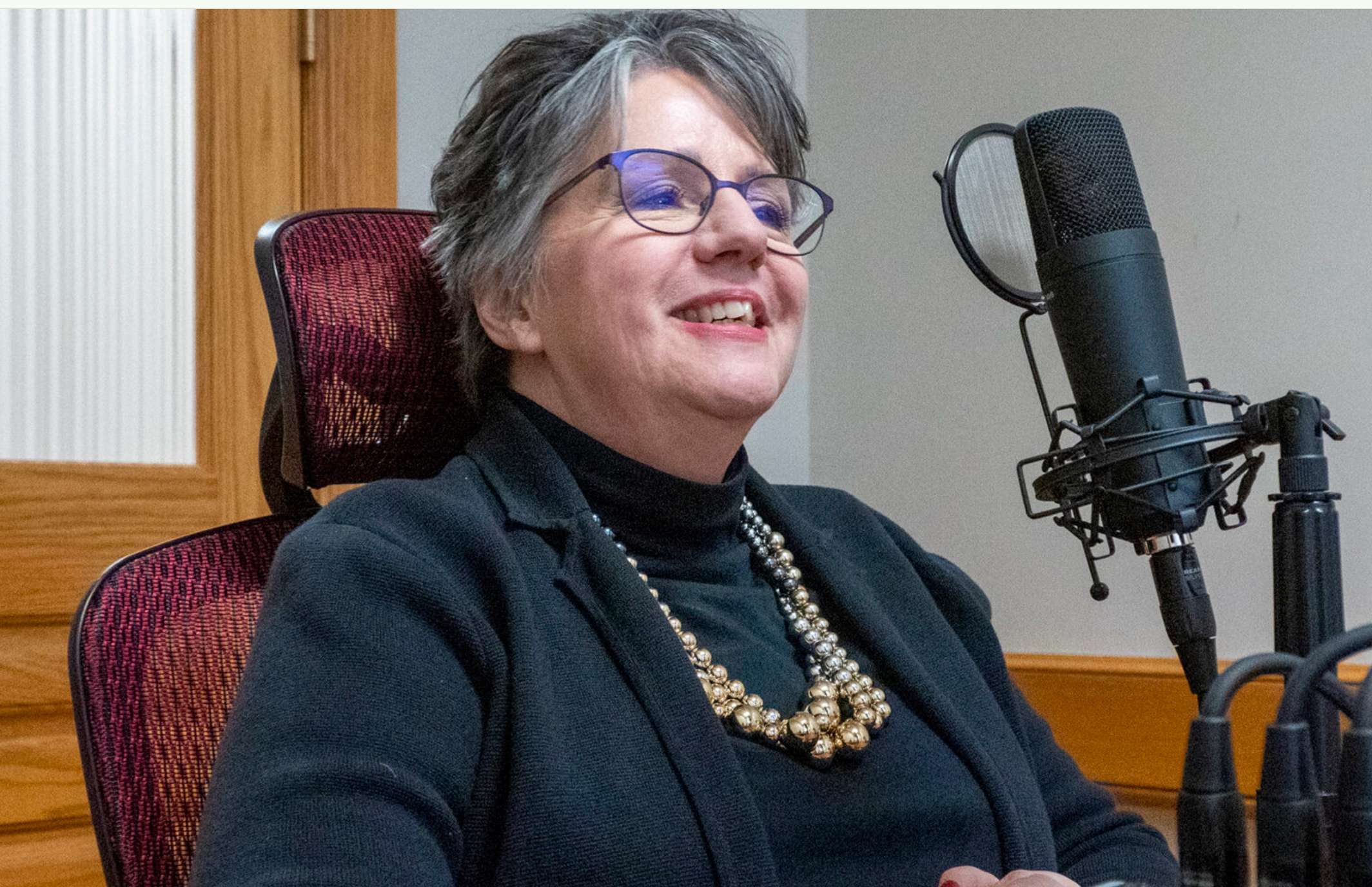 Leah Fliter advocates for or against bills in the Kansas Legislature on behalf of the Kansas Association of School Boards. She appears here for a recording of the Kansas Reflector podcast on Feb. 7, 2023. (Photo by Sherman Smith/Kansas Reflector)