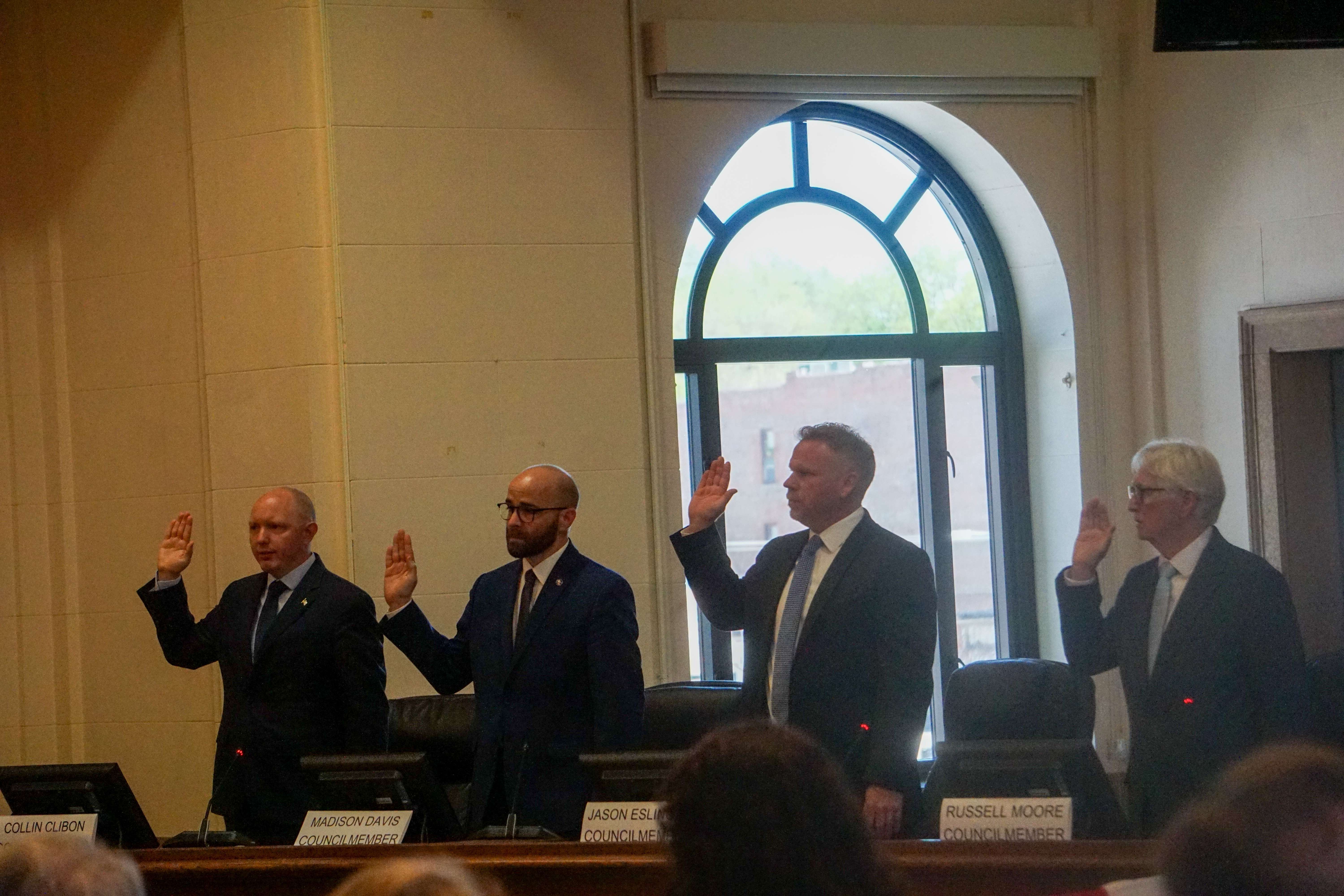 Councilmembers Russell Moore, Madison Davis, Jason Eslinger, and Collin Clibon take the oath of office/ Photo by Matt Pike