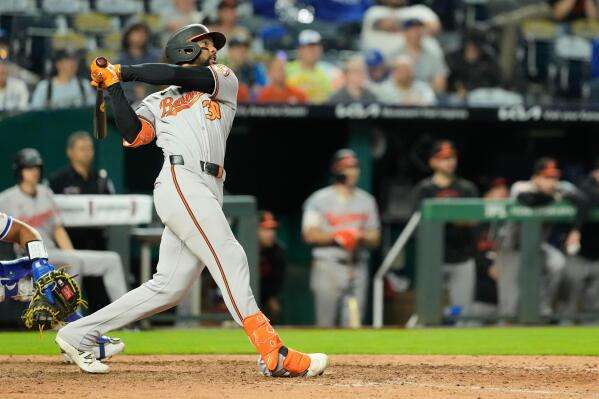 Baltimore Orioles' Leody Taveras watches his grand slam during the 12th inning of a baseball game against the Kansas City Royals, Monday, April 20, 2026, in Kansas City, Mo. (AP Photo/Charlie Riedel)