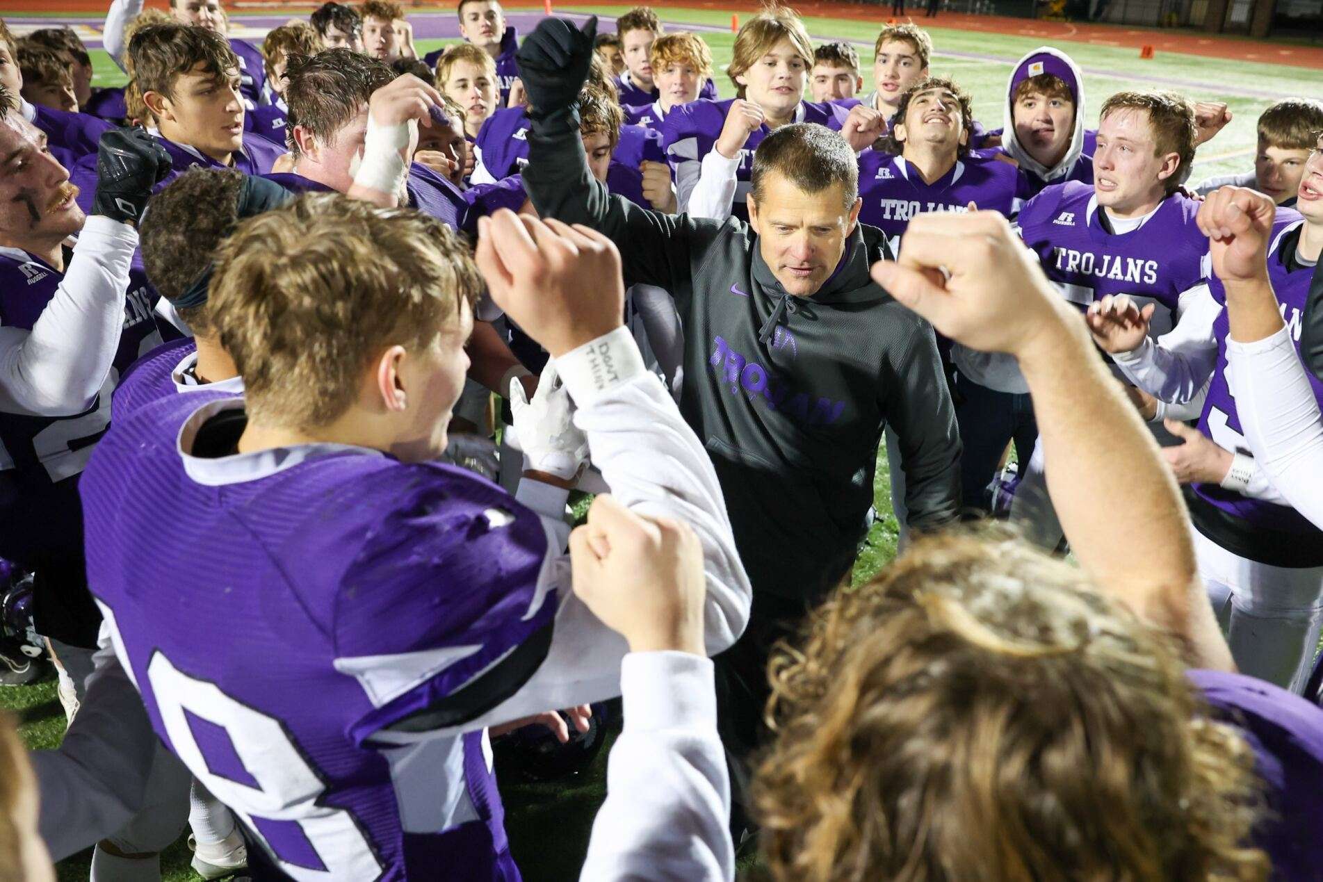 Mitch Gebhardt leads the huddle breakdown after defeating Beloit in the 2024 state semifinals.