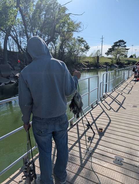 A Juvenile Services client enjoys a fishing trip at Veterans Lake recently.