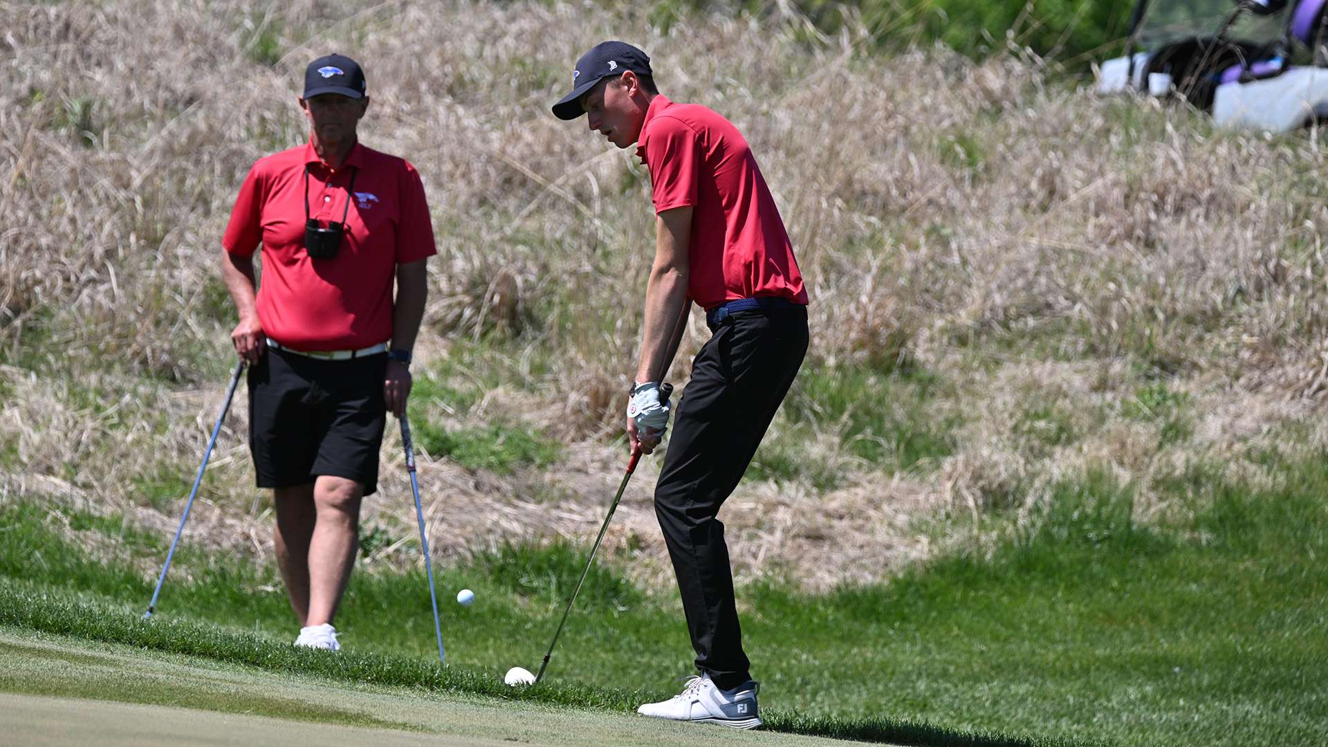 Hugo Duquaine chips this shot in for a birdie on the 17th hole as part of a fast finish that led him to the Region 6 Tournament individual championship on Tuesday at Colbert Hills in Manhattan. (Steve Carpenter/Blue Dragon Sports Information)