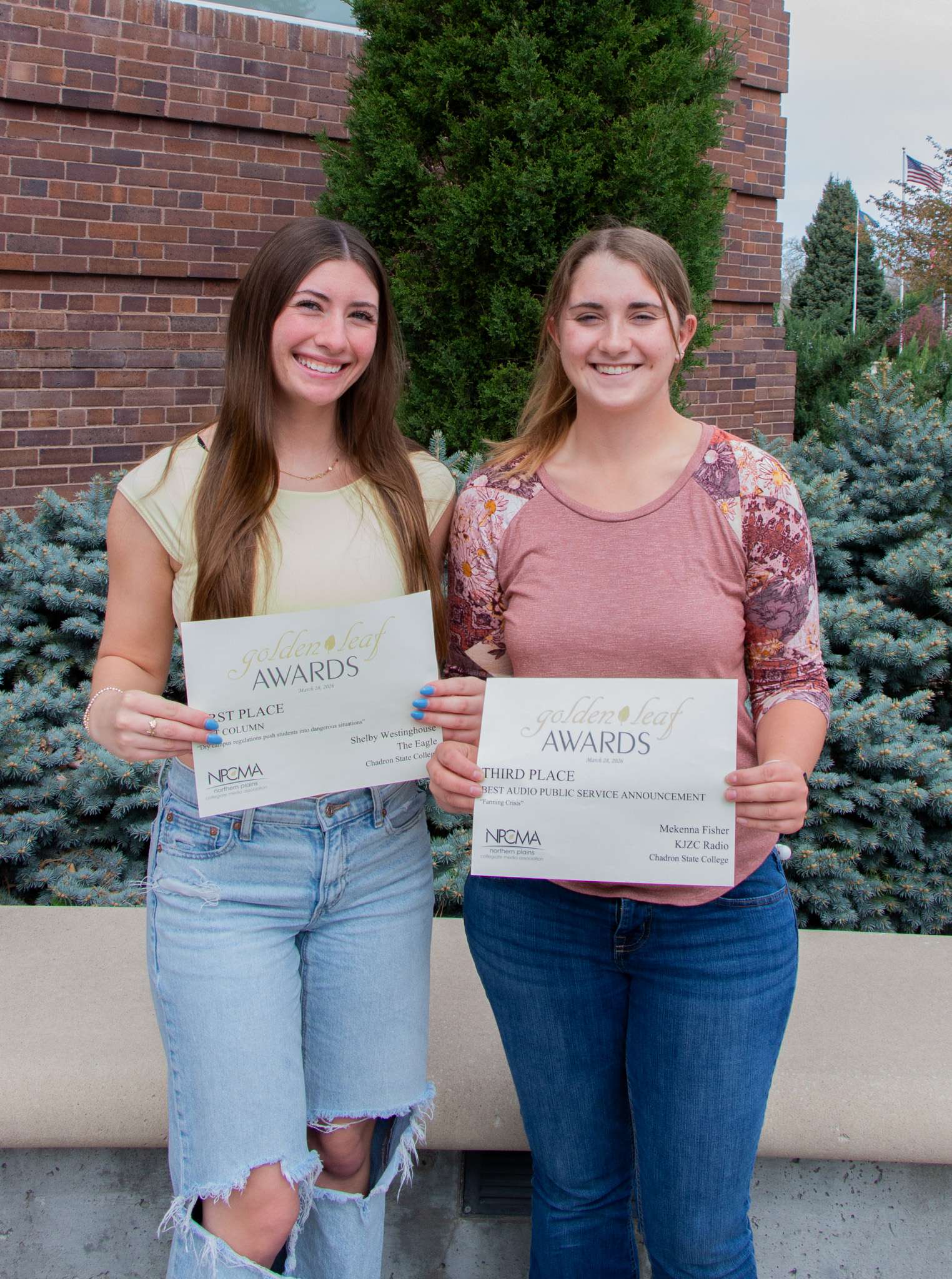 Chadron State College students Shelby Westinghouse of Hot Springs, S.D., left, and Mekenna Fisher of Hershey, Neb., right, received awards of distinction at this year's Golden Leaf Awards contest sponsored by the Northern Plains Collegiate Media Association, April 16, 2026. (Photo by Taylor Neugebauer/Chadron State College)