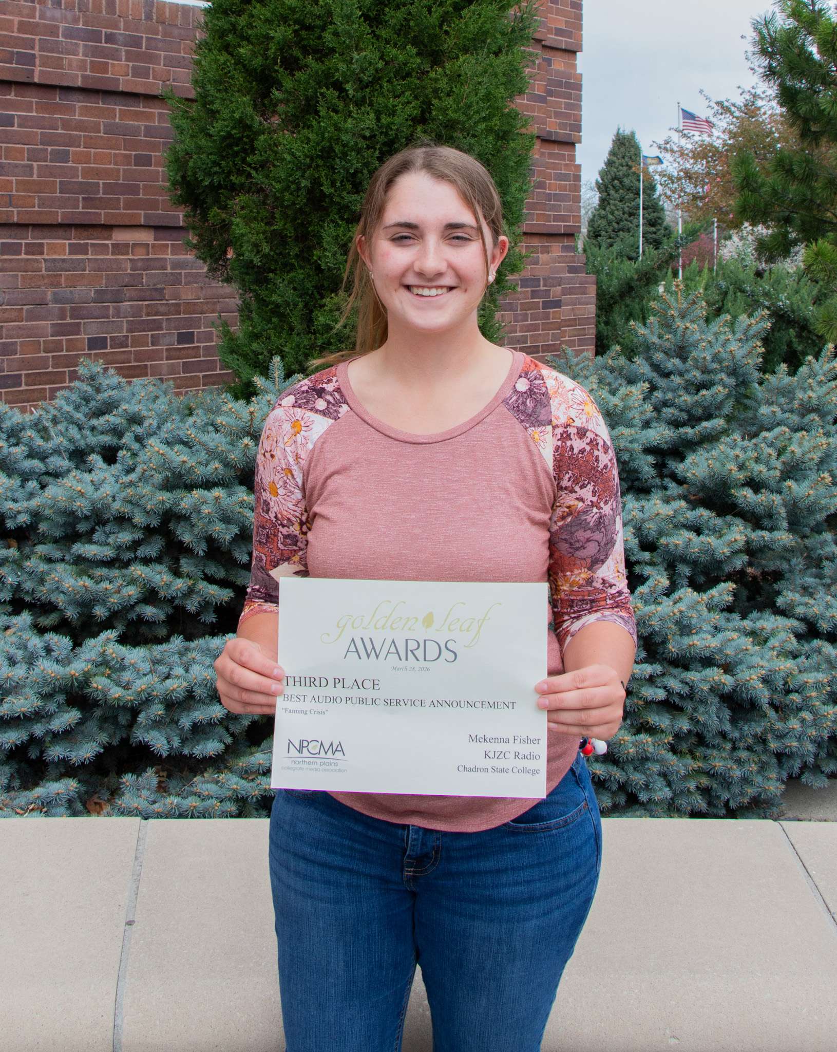 Chadron State College student Mekenna Fisher of Hershey, Neb., received an award of distinction at the Golden Leaf Awards contest sponsored by the Northern Plains Collegiate Media Association. She is the third-place winner in the Best Audio Public Service Announcement category for her broadcast-radio public service announcement about challenges faced by family-owned farms, April 16, 2026. (Photo by Taylor Neugebauer/Chadron State College)