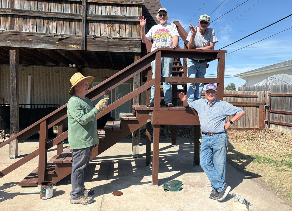 Habitat for Humanity of Ellis County rebuilt a homeowner's stairs as a part of its home repair program. Pictured from top left are Habitat volunteers Roger Lohrmeyer, Ken Rohleder and bottom Bob Albers and Phil Stahlman, project leader. Photo by Cristina Janney/Hays Post