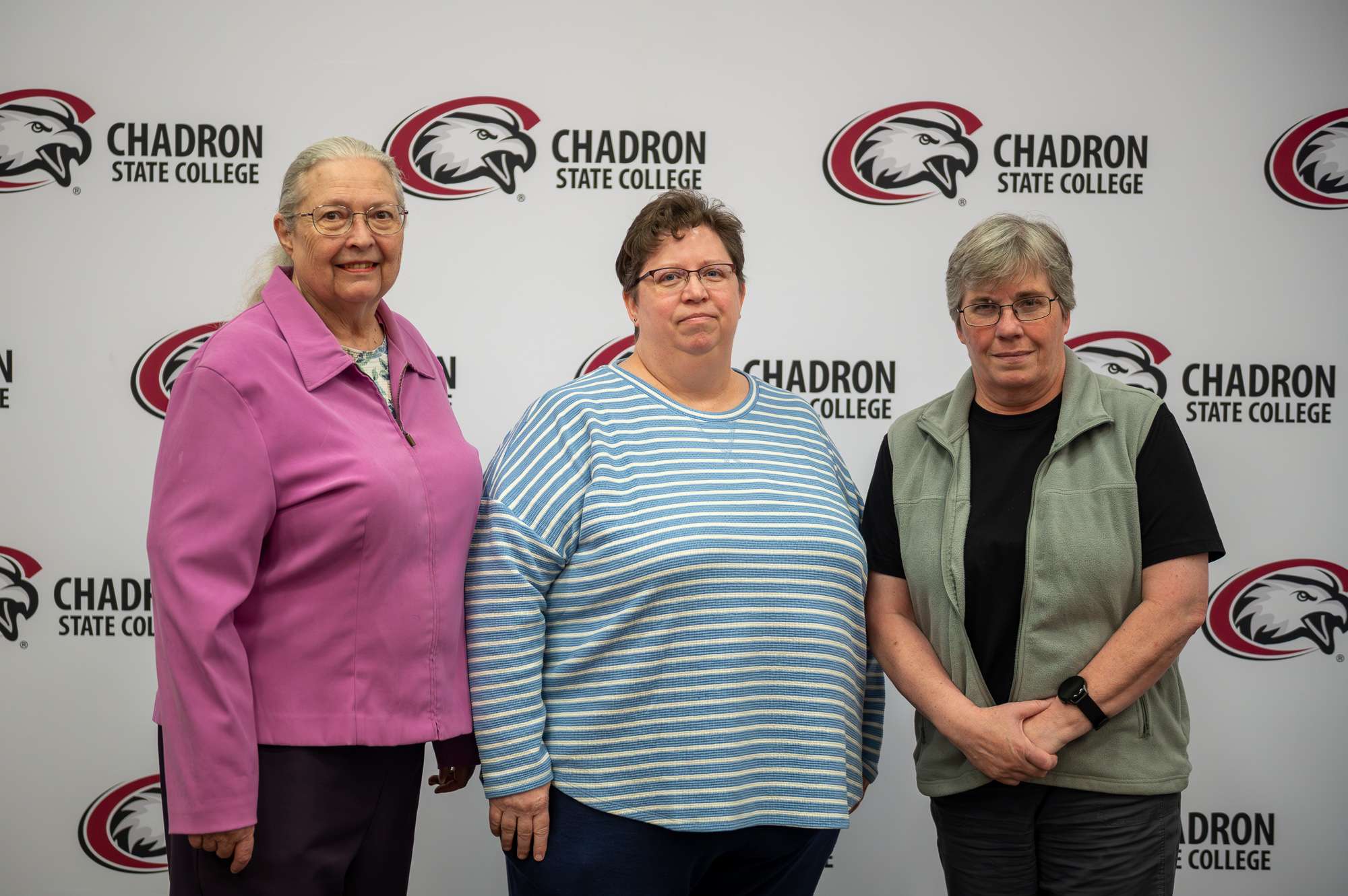 From left, Jennifer Wittrock, Angie Camerlinck, and Sharla Blonien pose for a photo while being recognized for 20 years of service during the Employee Appreciation Luncheon in teh Student Center Ballroom, April 16, 2026. (Photo by Sydney Bronw/Chadron State College)