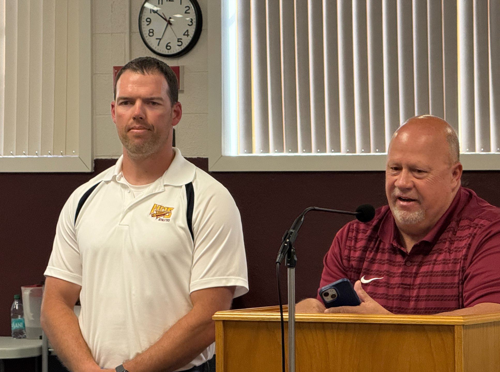 Bruce Rupp, right, Hays Middle School athletic director, honors, Hays Middle School coach&nbsp;Cade Scott, left, at the Hays USD 489 school board meeting on Monday night. Photo by Cristina Janney/Hays Post