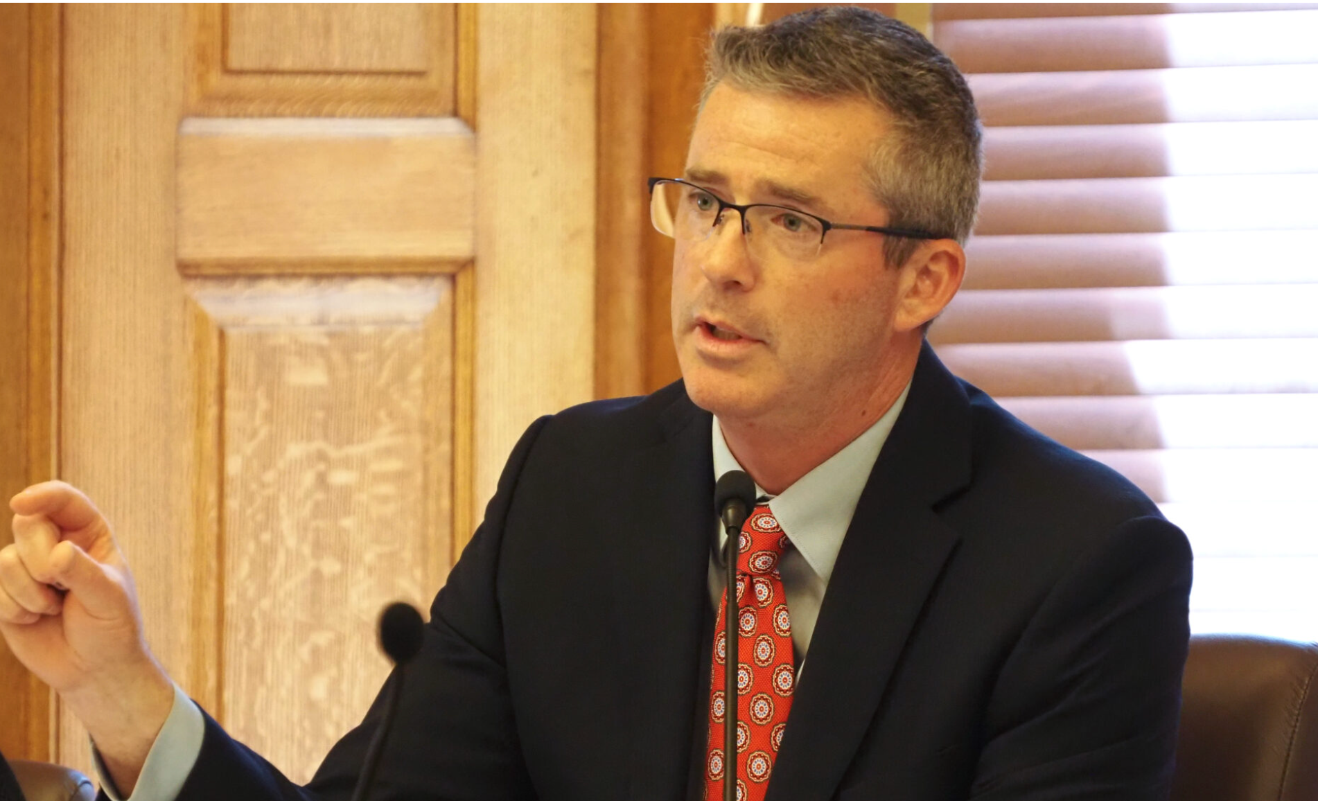  Kansas budget director Adam Proffitt is a nonvoting member of the state’s Education Funding Task Force. He appears here at a press conference on April 20, 2026, at the Statehouse. (Photo by Anna Kaminski/Kansas Reflector)