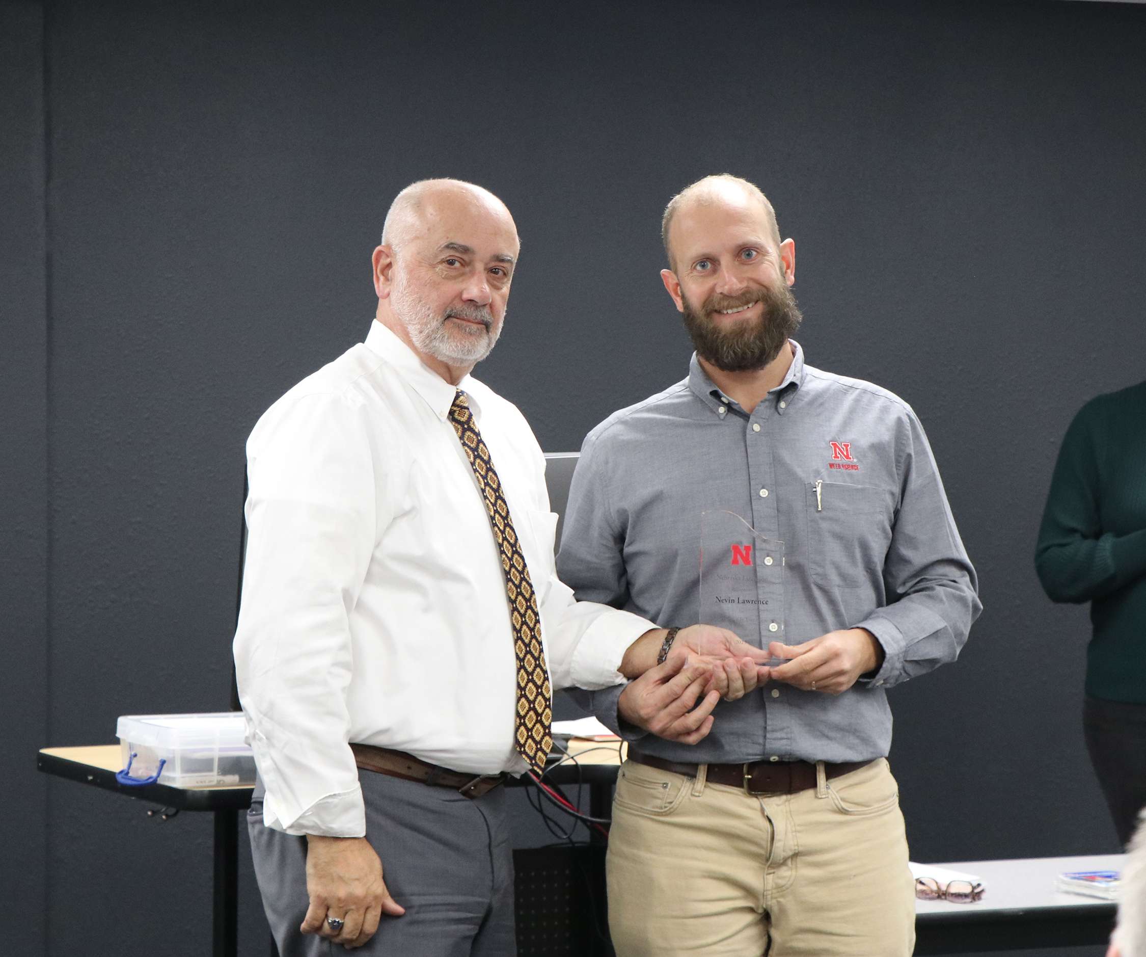 Nevin Lawrence, Nebraska Extension weed management specialist, right, accepted the “Excellence in Extension Individual Award” from Charlie Stoltenow, Dean/Director of Nebraska Extension. Photos by Chabella Guzman