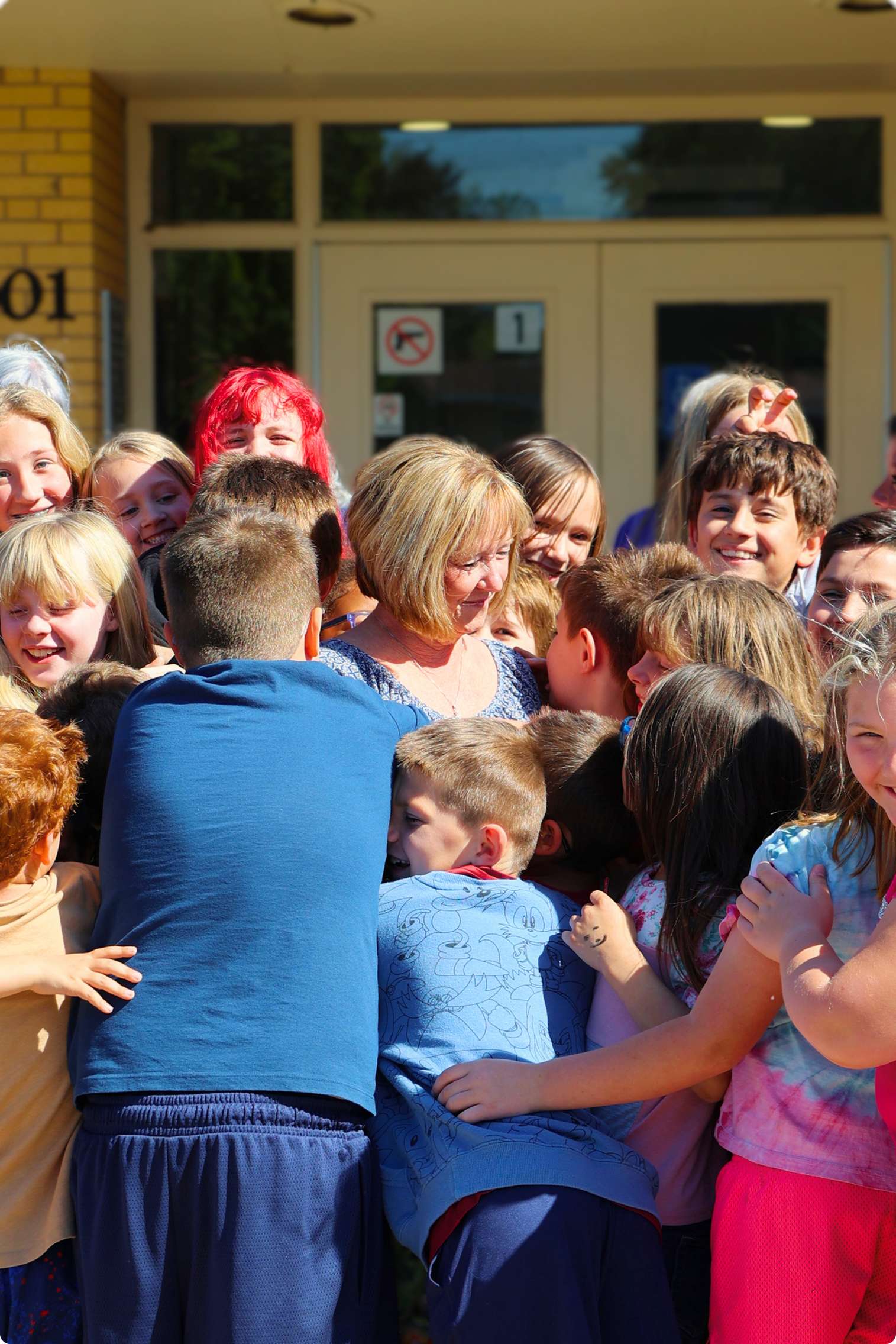 Phyllis Boller surrounded by Milford Elementary School students ( Photos by Sam Adams )