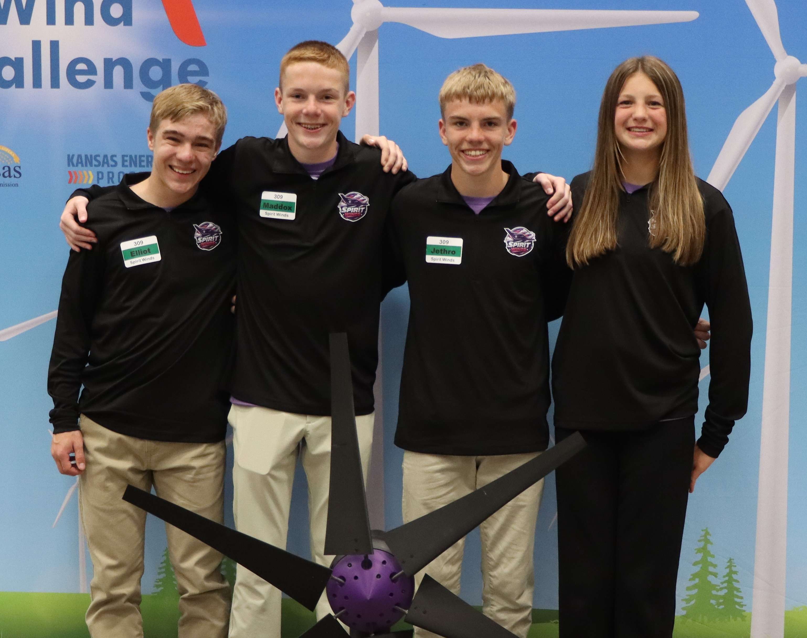 Oakley High School (<a href="https://links-2.govdelivery.com/CL0/https:%2F%2Fwww.kcc.ks.gov%2Fimages%2FPress_Links%2F2026%2520State%2520KidWind%2F2026%2520state%2520winner%2520photos%2FOakley-SpiritWinds_11Turbine.jpg%3Futm_medium=email%26utm_source=govdelivery/1/0101019db18920e8-aa11c1c9-749e-4f79-9ab9-57425ab5e962-000000/L50EydRCSCBlDbVt5zXJl6sEmC537IyK3iOuLt9ePEc=452" target="_blank">Spirit Winds</a>), Oakley