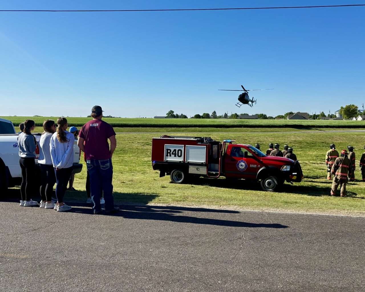 Role-playing victims watching an EagleMed helicopter land to airlift their classmate to a hospital&nbsp;during a mock crash at Victoria High School. Photo by Tony Guerrero/Hays Post