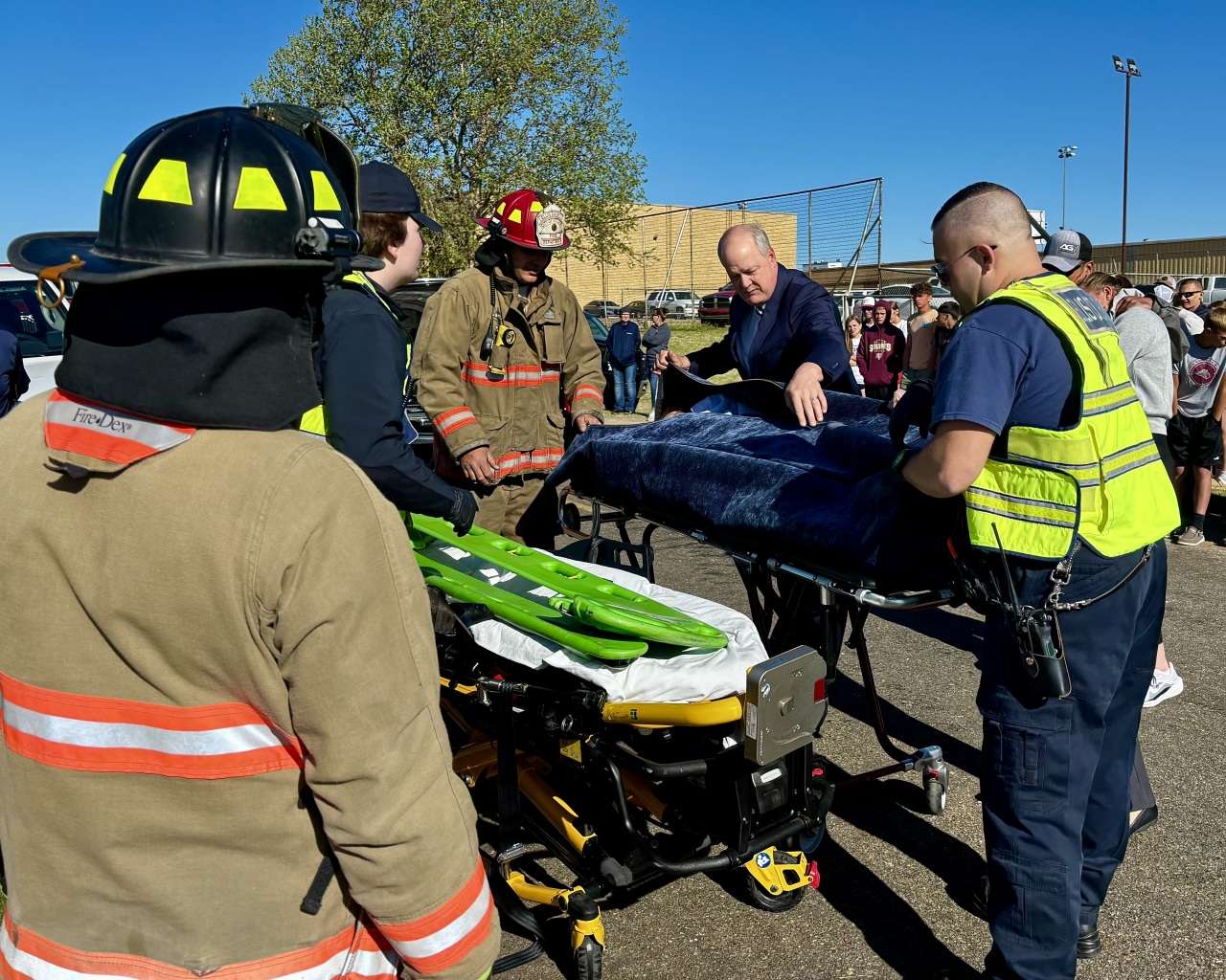 The student acting as a victim of the mock crash being zipped into a body bag before being placed in a hearse. The students' parents, also part of the demonstration, looked on in distress. Photo by Tony Guerrero/Hays Post