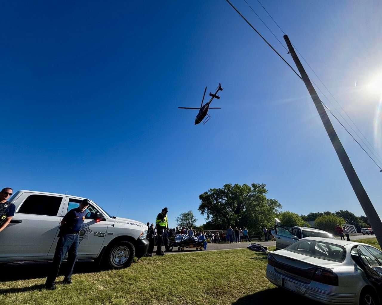 The helicopter with a student victim flying over the scene of the mock crash at Victoria High School. Photo by Tony Guerrero/Hays Post