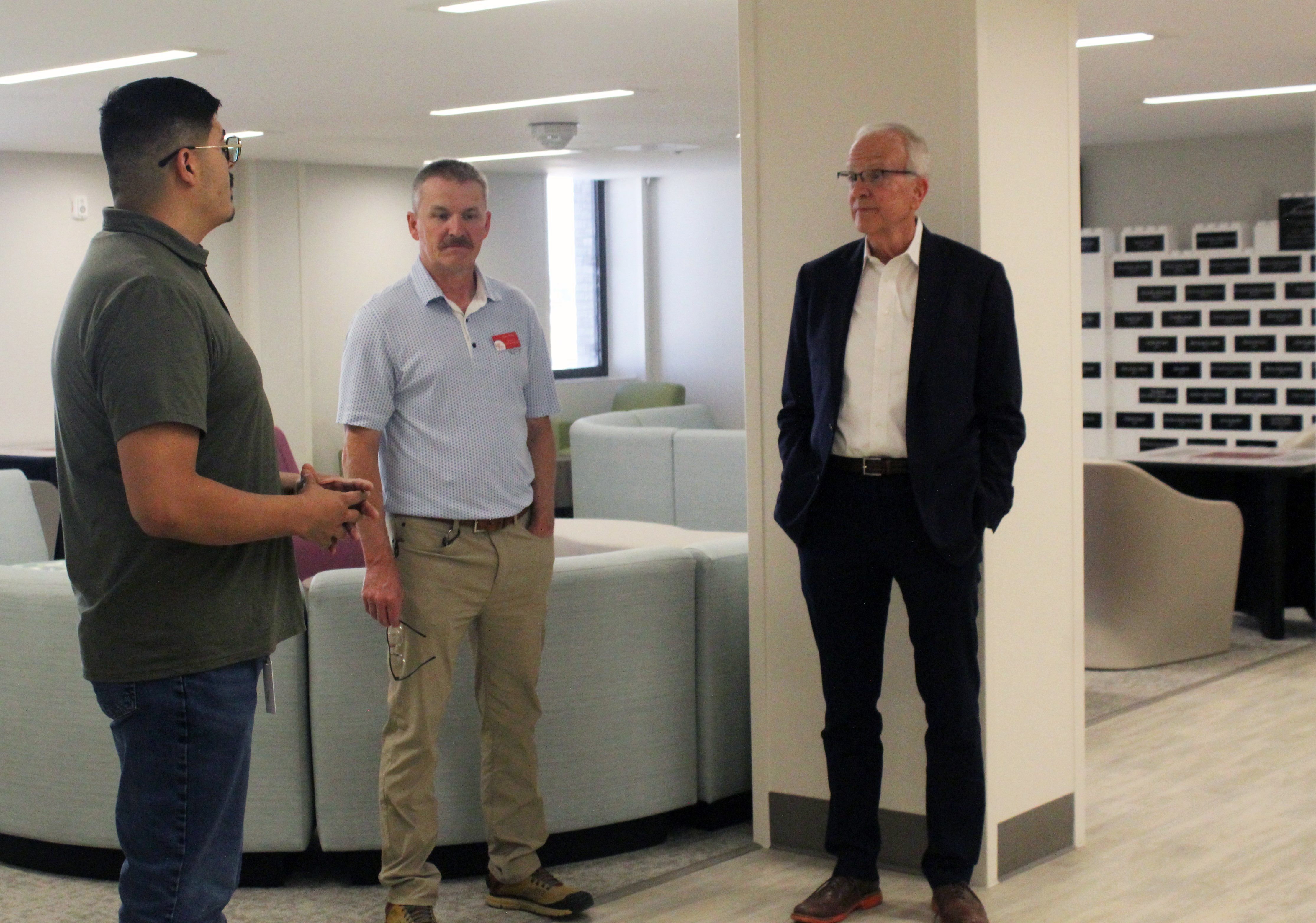 Benito Rivera-Madrid,&nbsp;Crisis Intervention Center operations manager, and Mark Dinkel, High Plains director of clinical programs, discuss the center's programs with Moran in the one of its community rooms.&nbsp;Photo by Cristina Janney/ Hays Post<br>