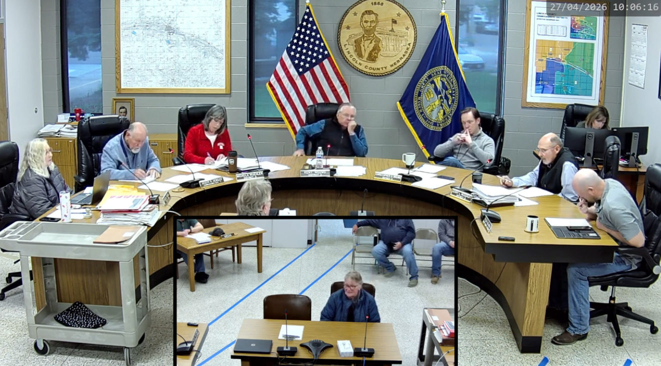 Victoria Usdil, manager with Fast Stop Stores, addresses Lincoln County commissioners Monday during discussion preceding approval of a liquor license for the Hershey Fast Stop location.