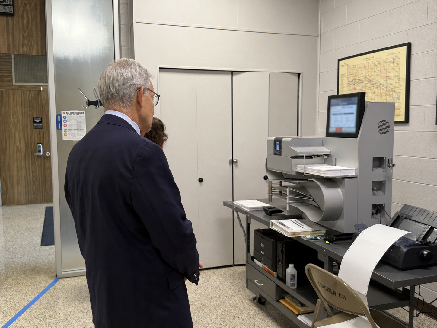 Nebraska Secretary of State Bob Evnen watches ballot counting equipment testing in Lincoln County during a stop on his statewide Transparency Tour ahead of Nebraska’s May 12 primary. (Photo by Paxton Gordon/North Platte Post)