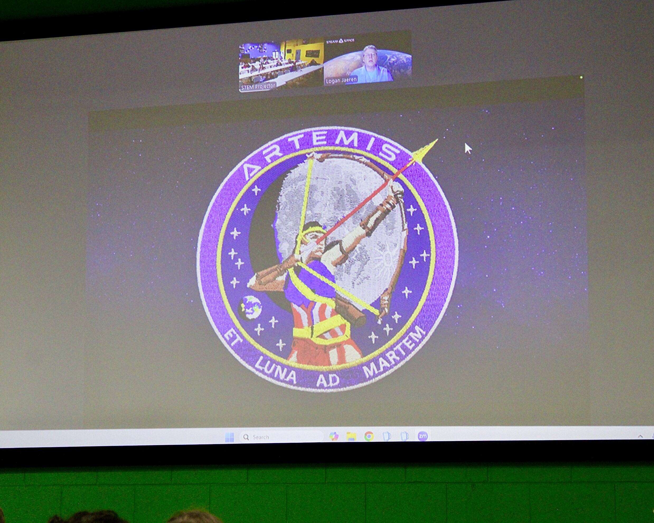 Logan Jaeren, a senior product design leader and lifelong space enthusiast, virtually discussing an Artemis patch. Photo by Tony Guerrero/Hays Post