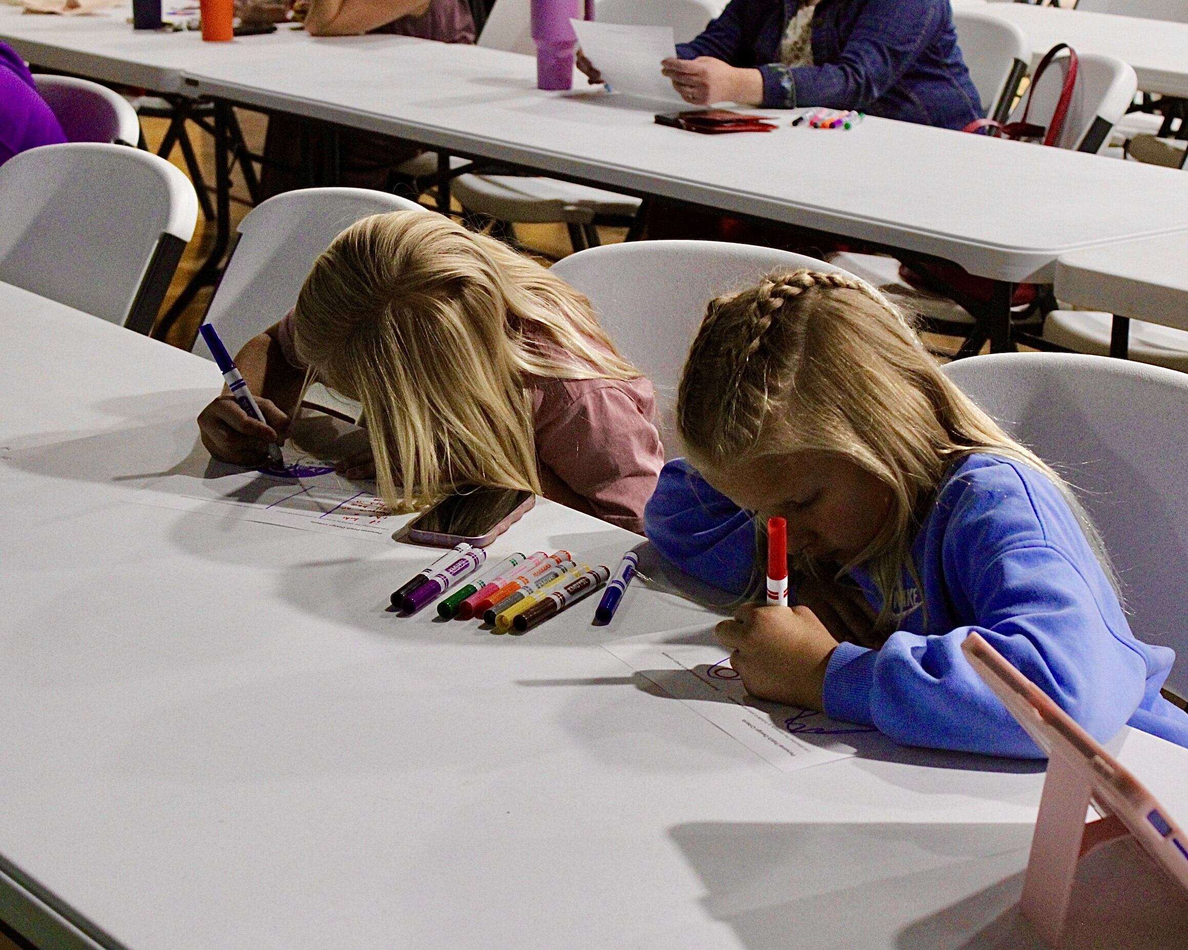 Attendees drawing their own mission patches at STEM Harvest. Photo by Tony Guerrero/Hays Post