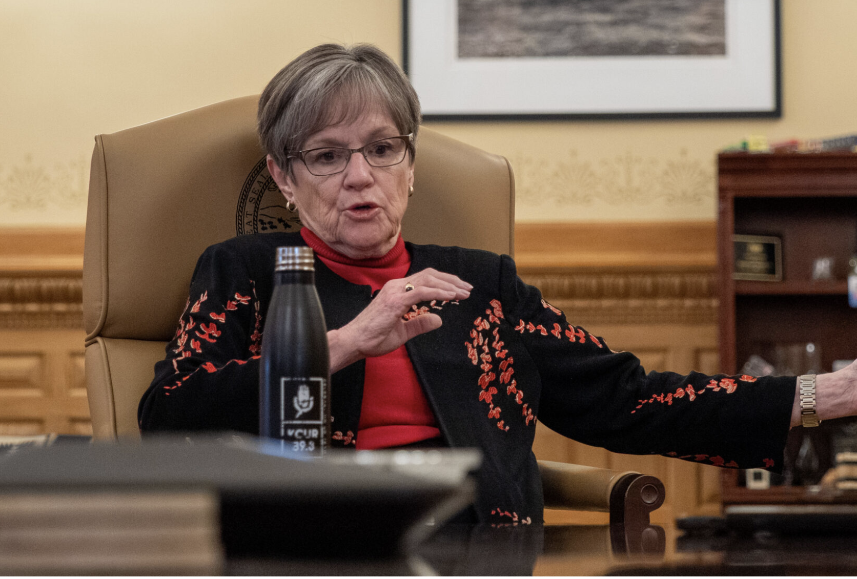  Gov. Laura Kelly, shown here answering a reporter's questions in February, signed a bill on April 27, 2026, that expands employer tax credits for child care. (Photo by Sherman Smith/Kansas Reflector)