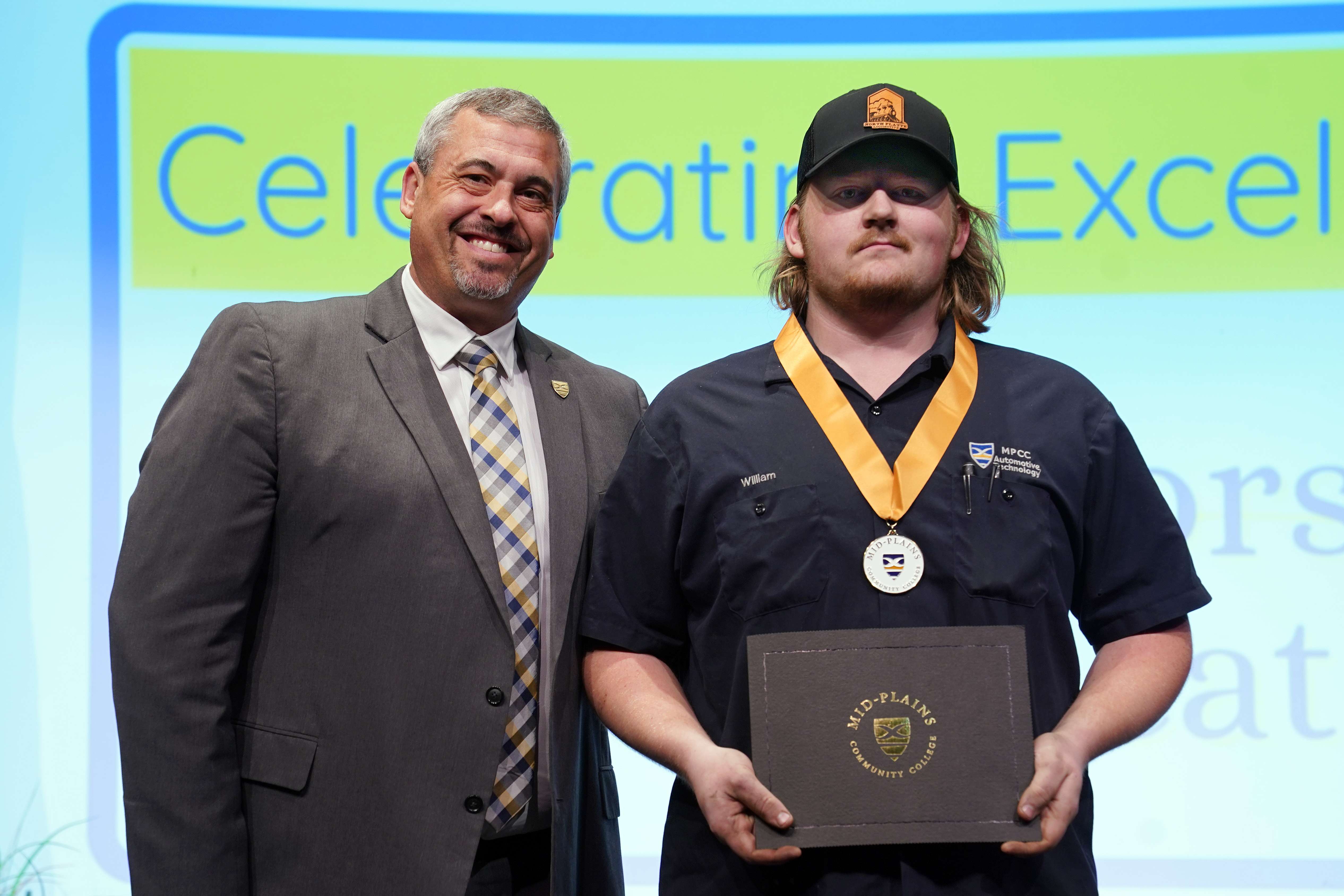 Presidential Award recipient William Anderson (right) is recognized by MPCC President Ryan Purdy during the North Platte Community College Honors Convocation Monday afternoon on South Campus. (NPCC)