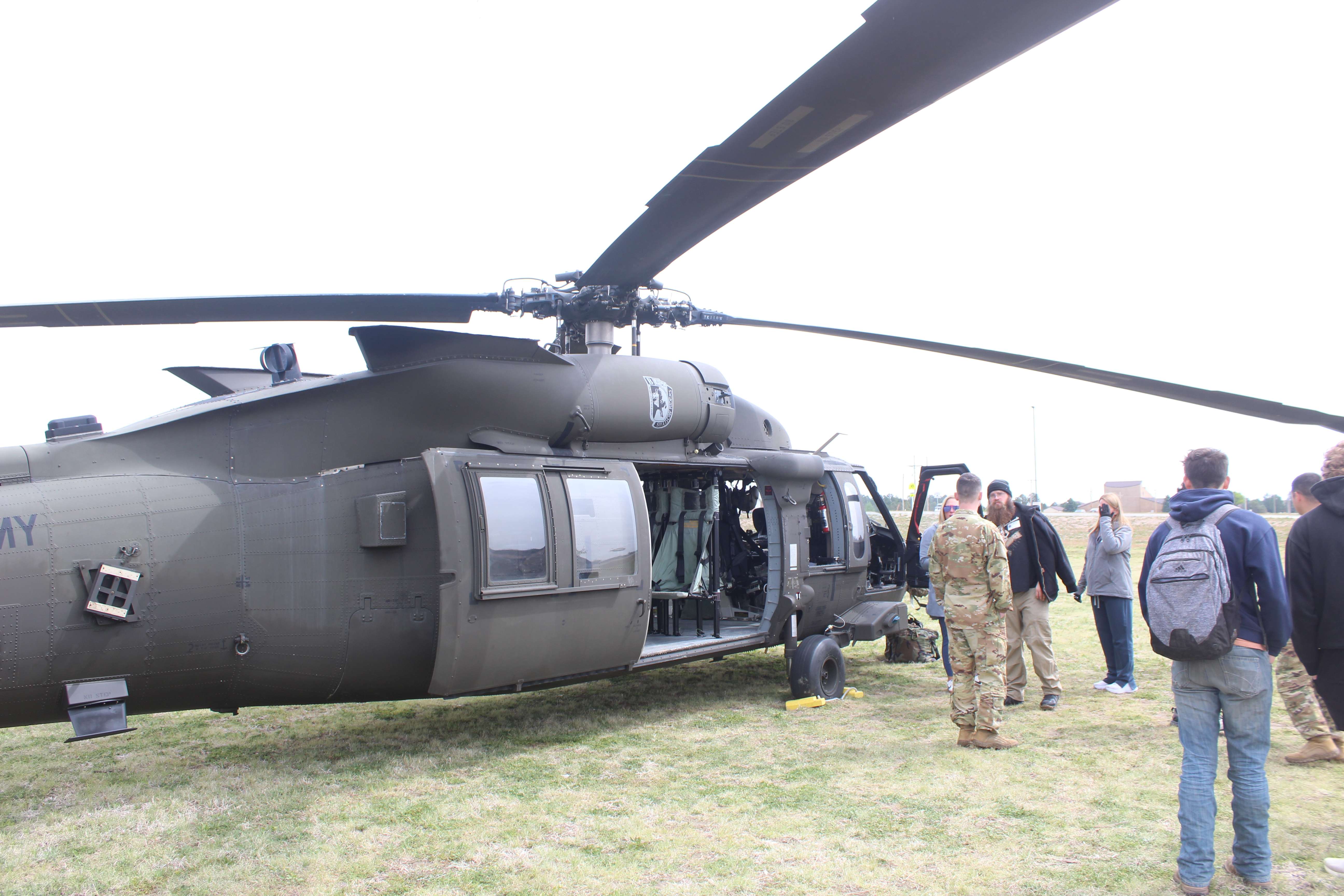 Students and community members view the National Guard Blackhawk helicopters before flights Wednesday from Hays High School.&nbsp;Photo by Cristina Janney/Hays Post