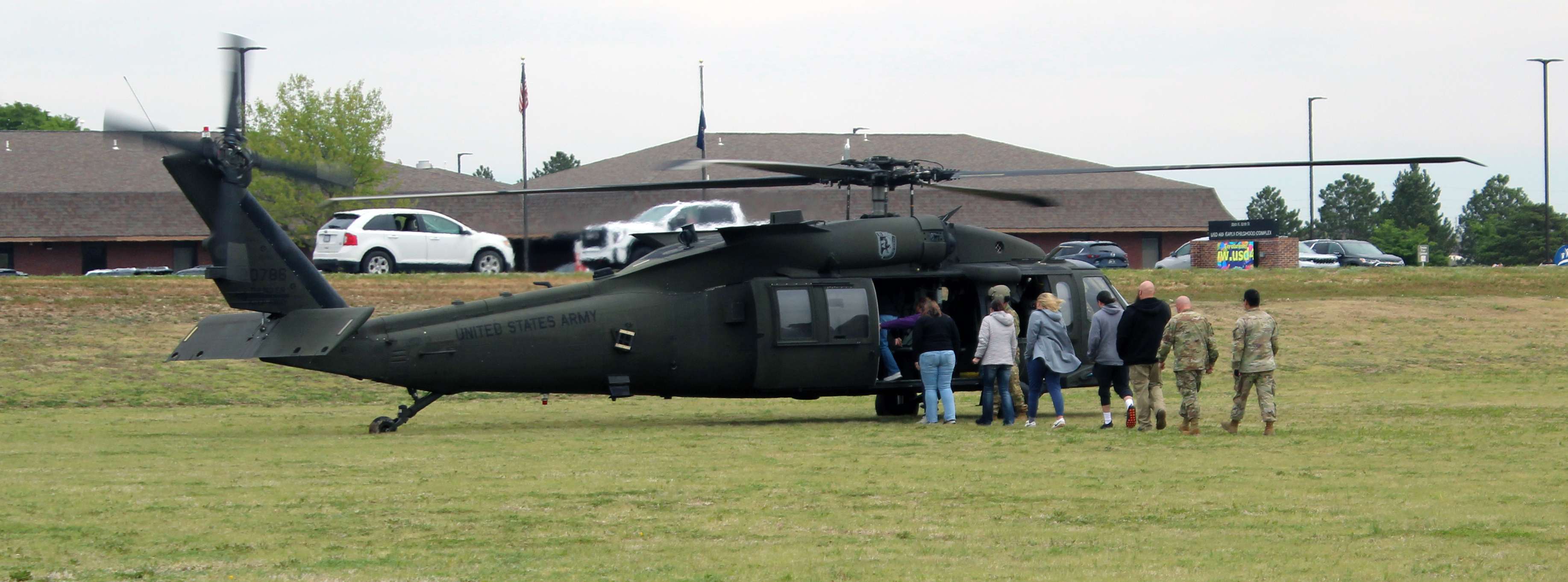 Passengers board one of the Blackhawks Wednesday outside of Hays High School.&nbsp;Photo by Cristina Janney/Hays Post