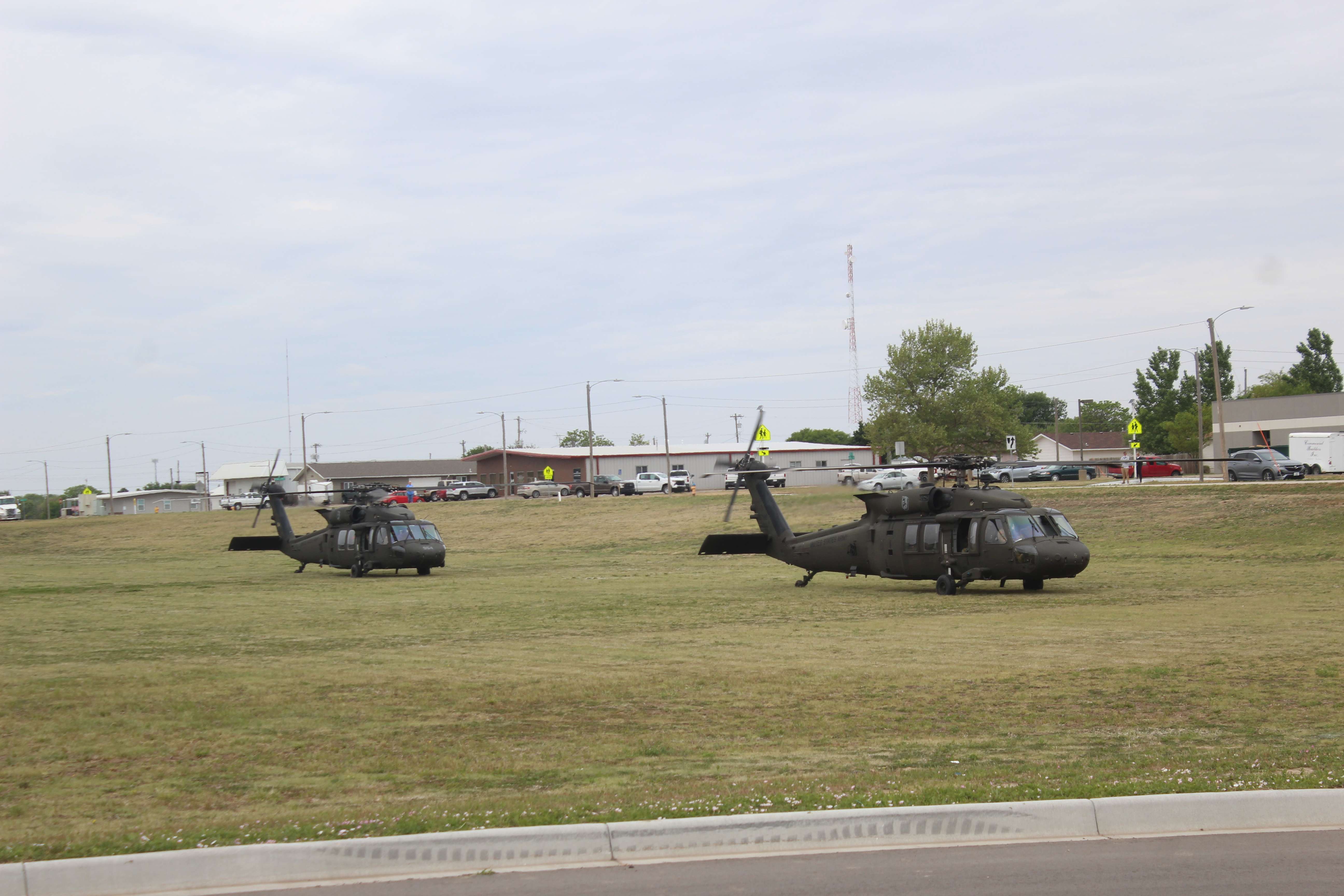 Kansas National Guard Blackhawk helicopters preparing for takeoff on Wednesday at Hays High School.&nbsp;Photo by Cristina Janney/Hays Post