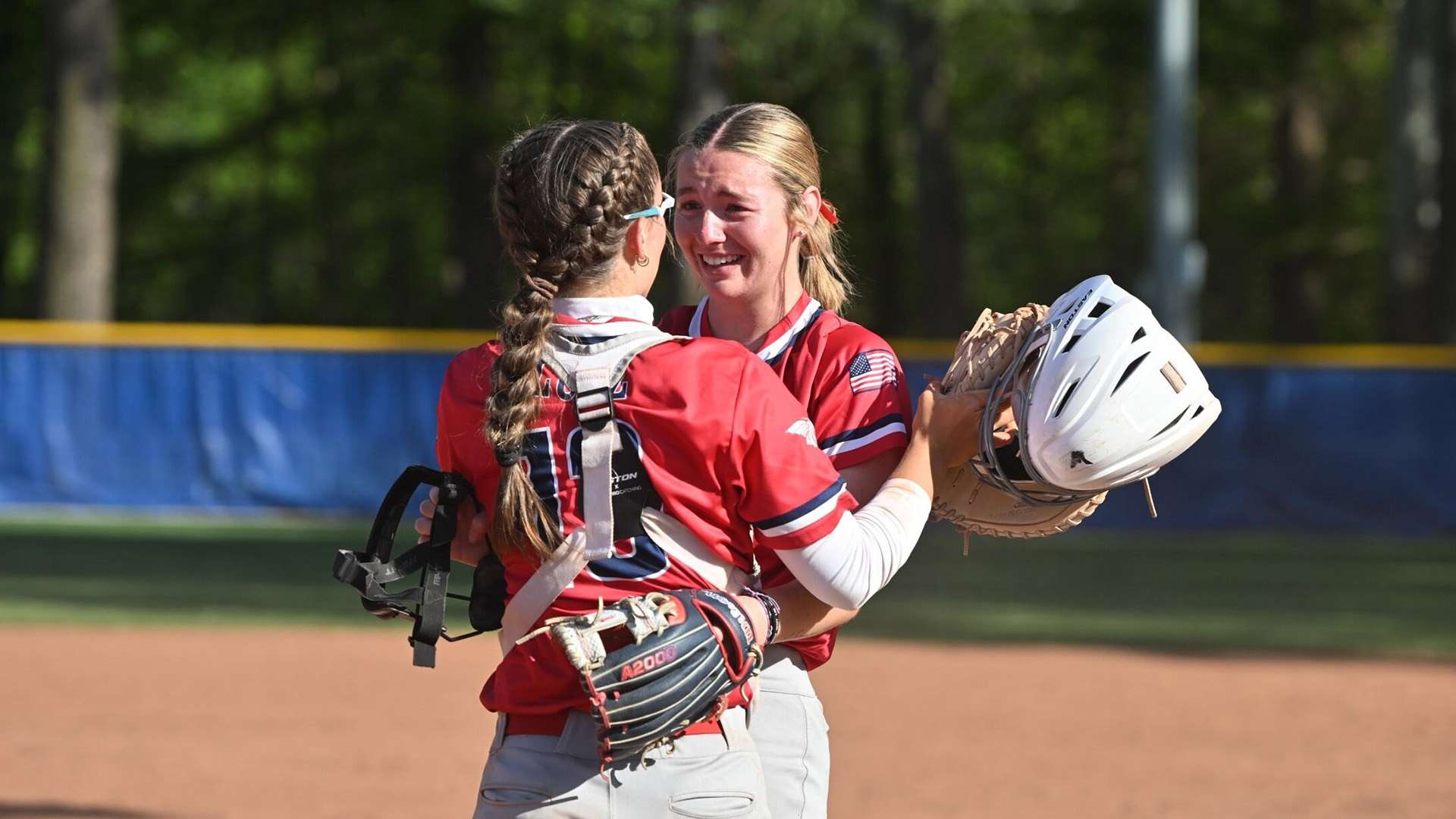 Starting pitcher Alyssa Rogers celebrates with catcher Addi Lutz after the final out of Game 2, a 10-1 Blue Dragon victory, that clinched the 2026 KJCCC Division I softball championship on Wednesday at Pratt.
