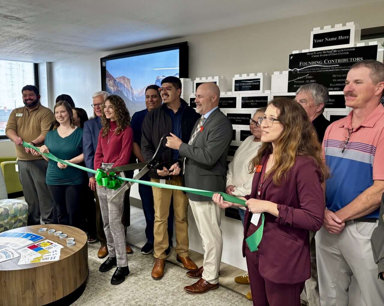  Craig Poe, High Plans Mental Health executive director, with his team and other officials cutting a ribbon for the new Crisis Intervention Center. Hosted by the Chamber in Hays. Photo by Tony Guerrero/Hays Post