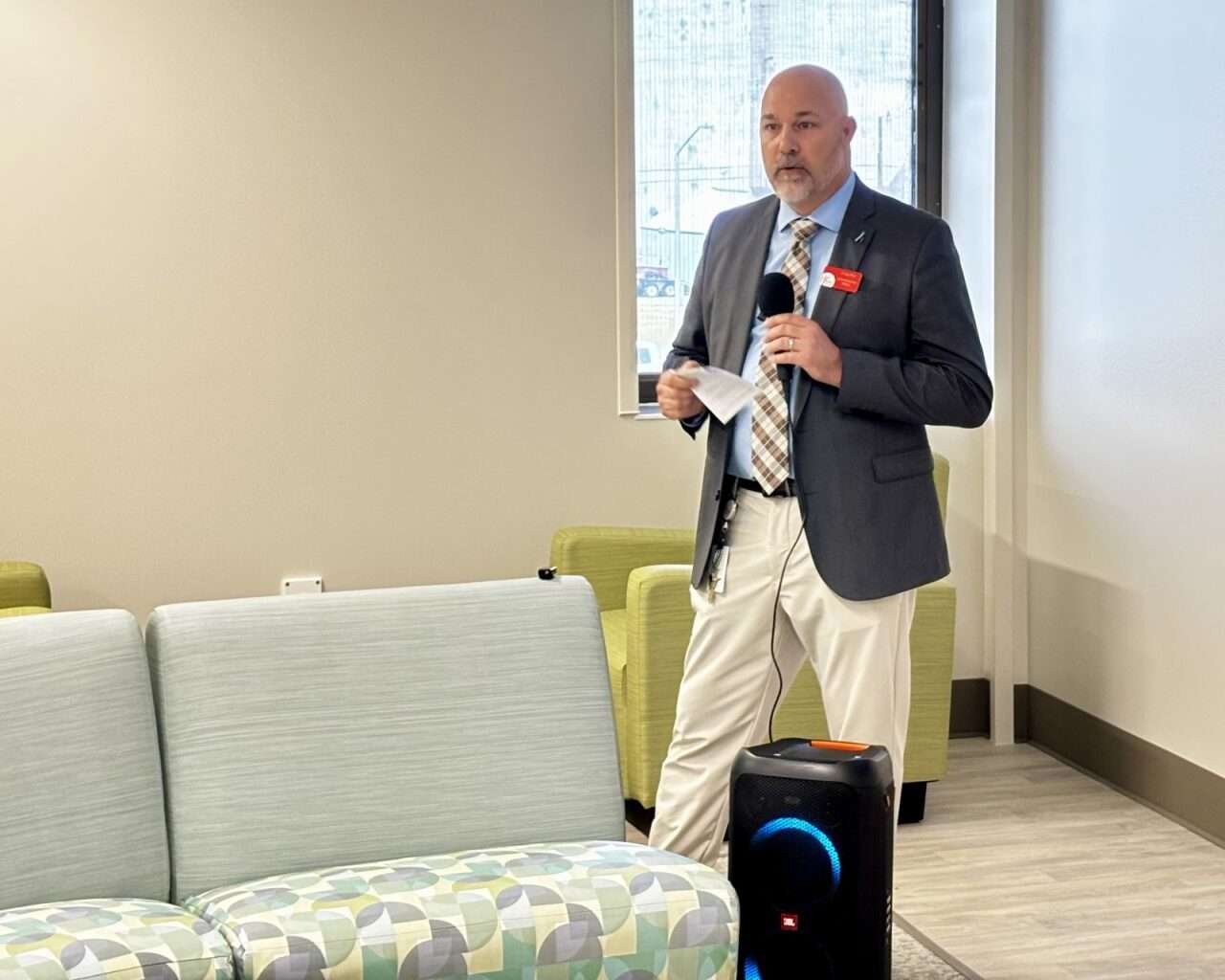 Craig Poe, High Plans Mental Health executive director, speaking to a room filled of community members during the Crisis Intervention Center's grand opening. Photo by Tony Guerrero/Hays Post