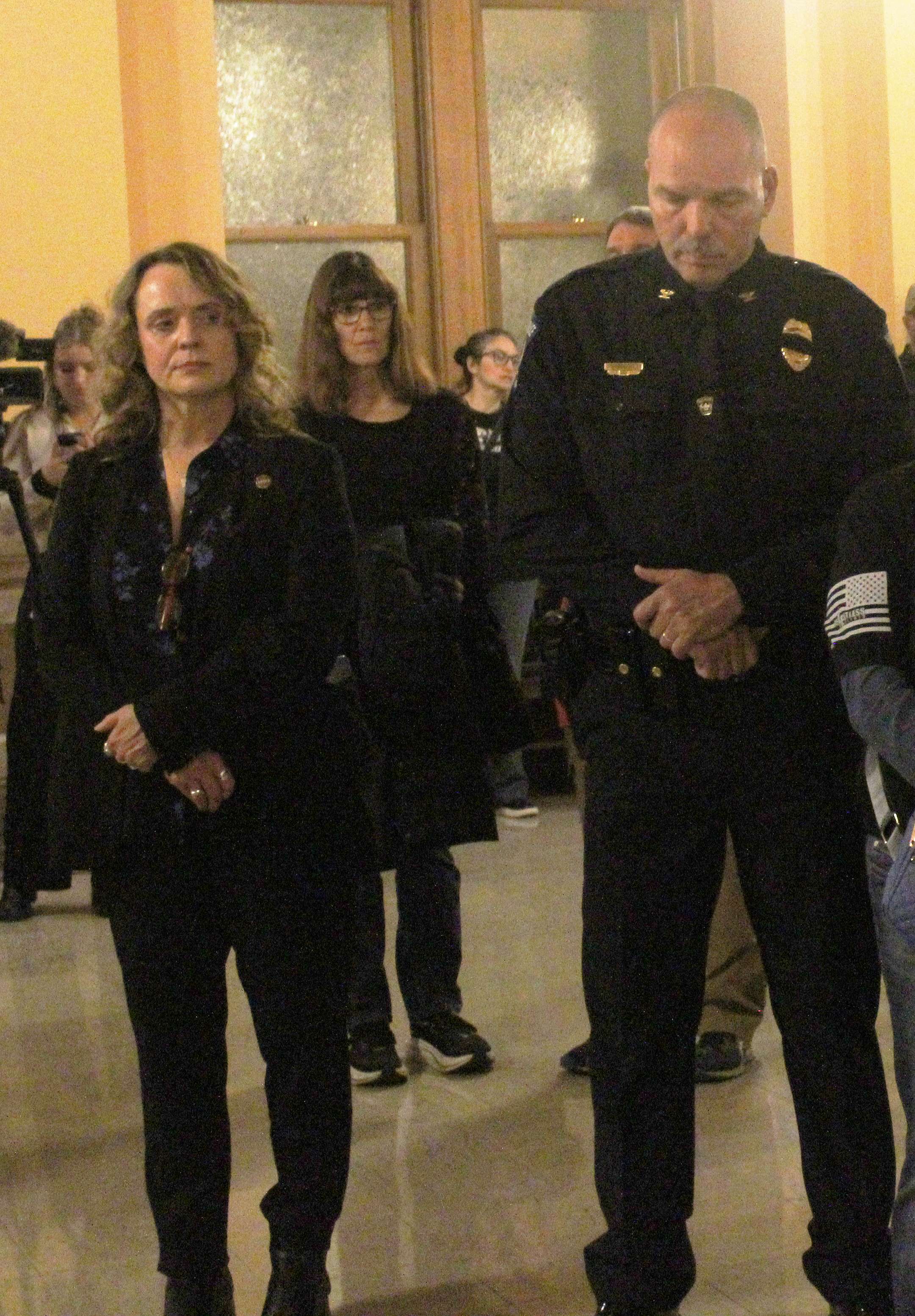 Hays Police Chief Don Scheibler stands silent as bagpipes and a drum corps plays during a ceremony for fallen officers at the Capitol on Thursday.&nbsp;Photo by Cristina Janney/Hays Post